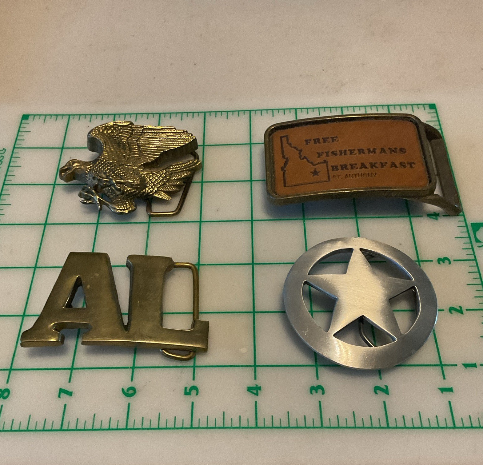 Lot of 4belt buckles brass pewter Star. Brass Eagle and others