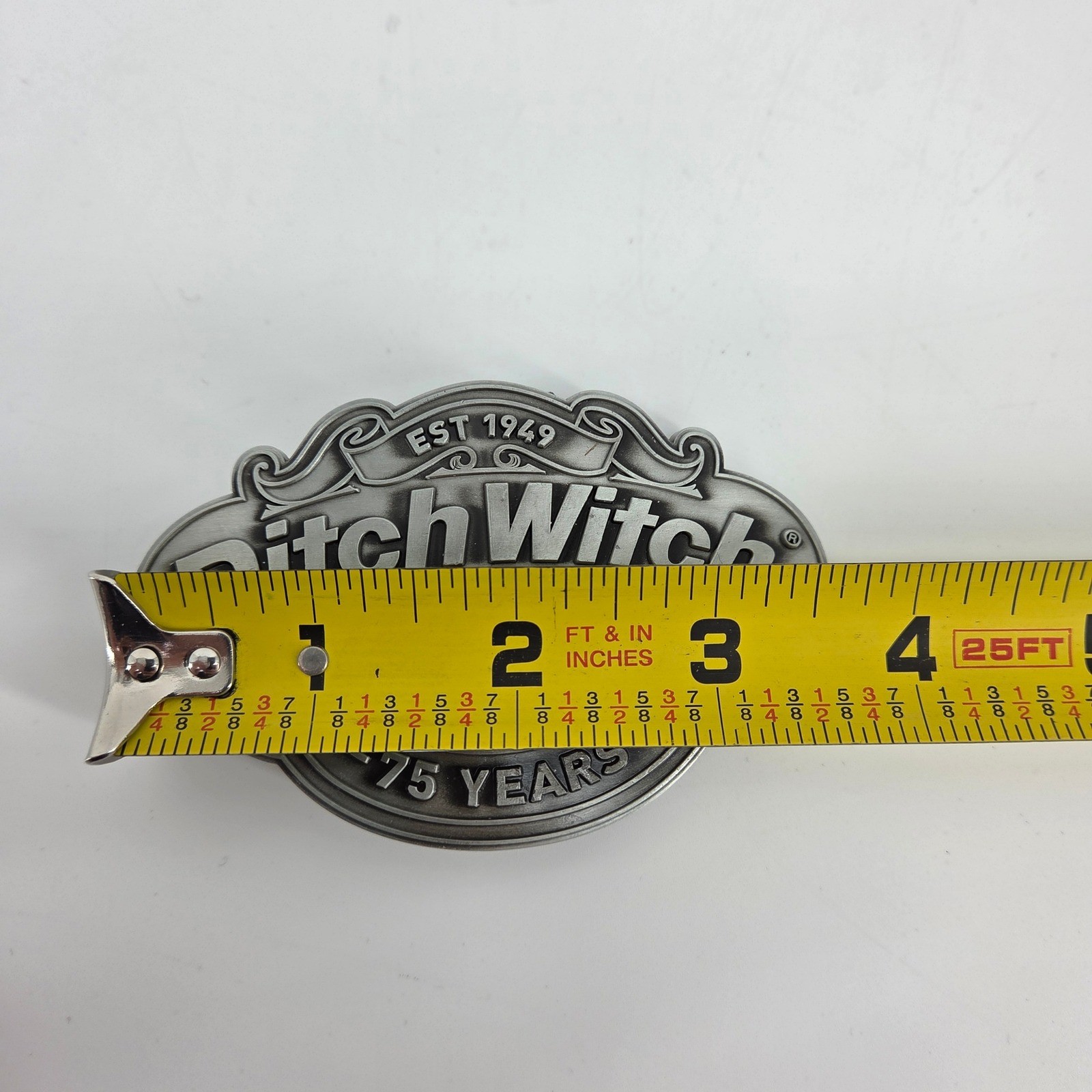Ditch Witch Construction 75 Year Anniversary Belt Buckle Metal Logo Collectible