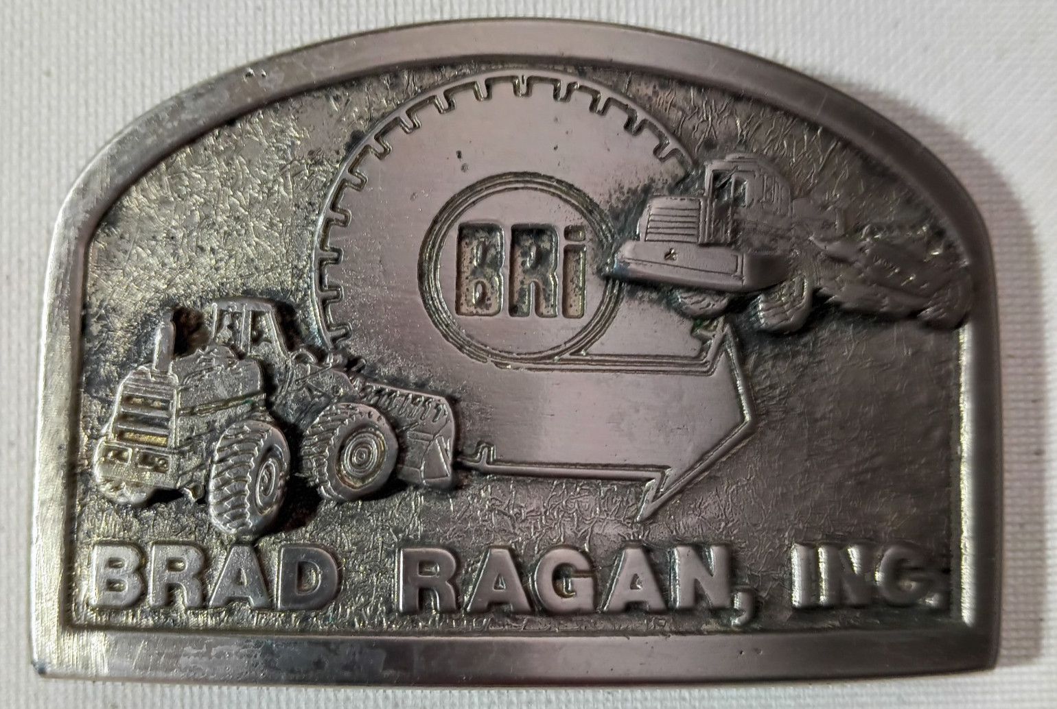 Vtg BRAD RAGAN Inc BRI Ag Construction On/Off Road Tire Dealer Belt Buckle