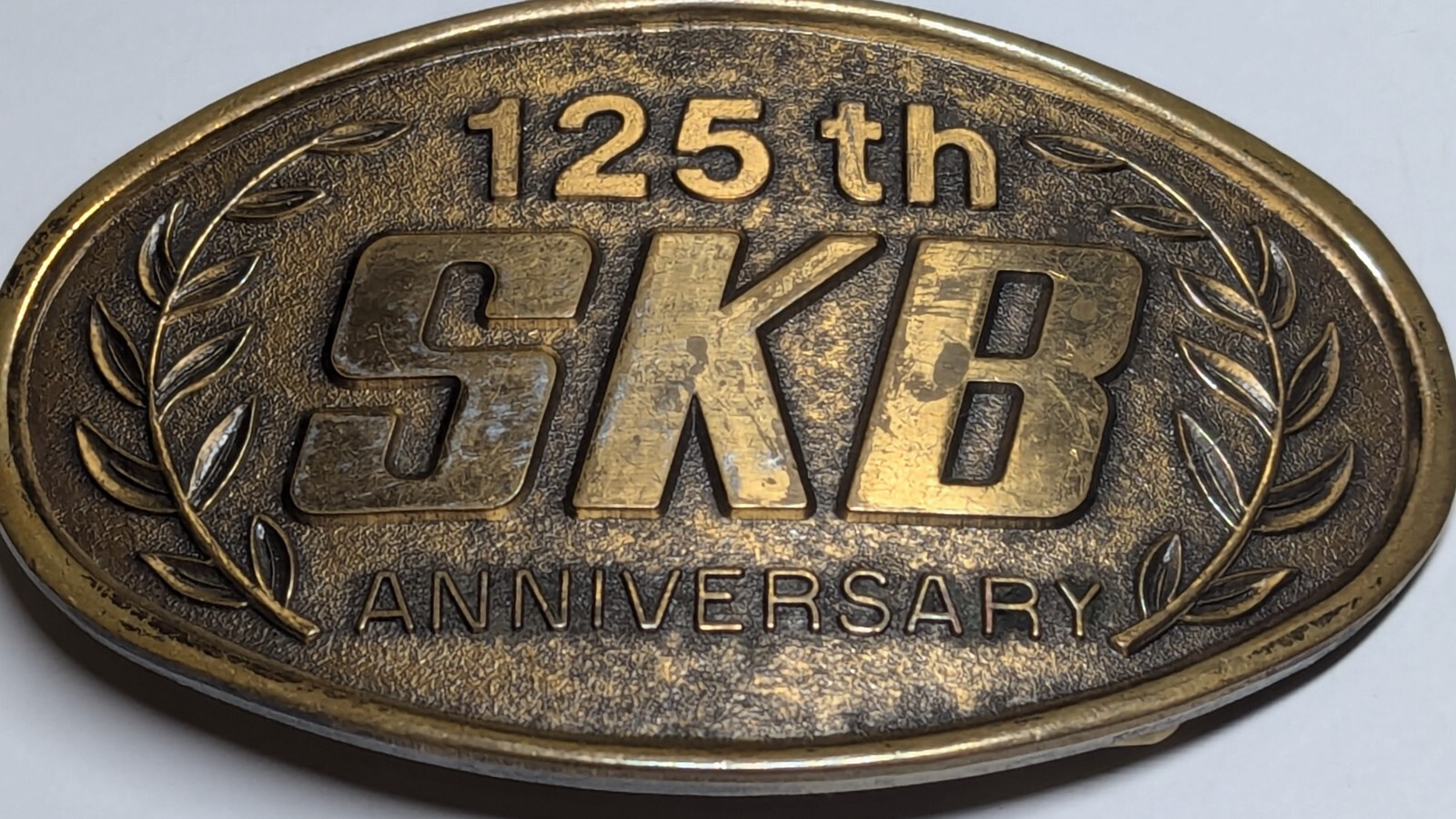 VINTAGE 125TH ANNIVERSARY SKB BELT BUCKLE