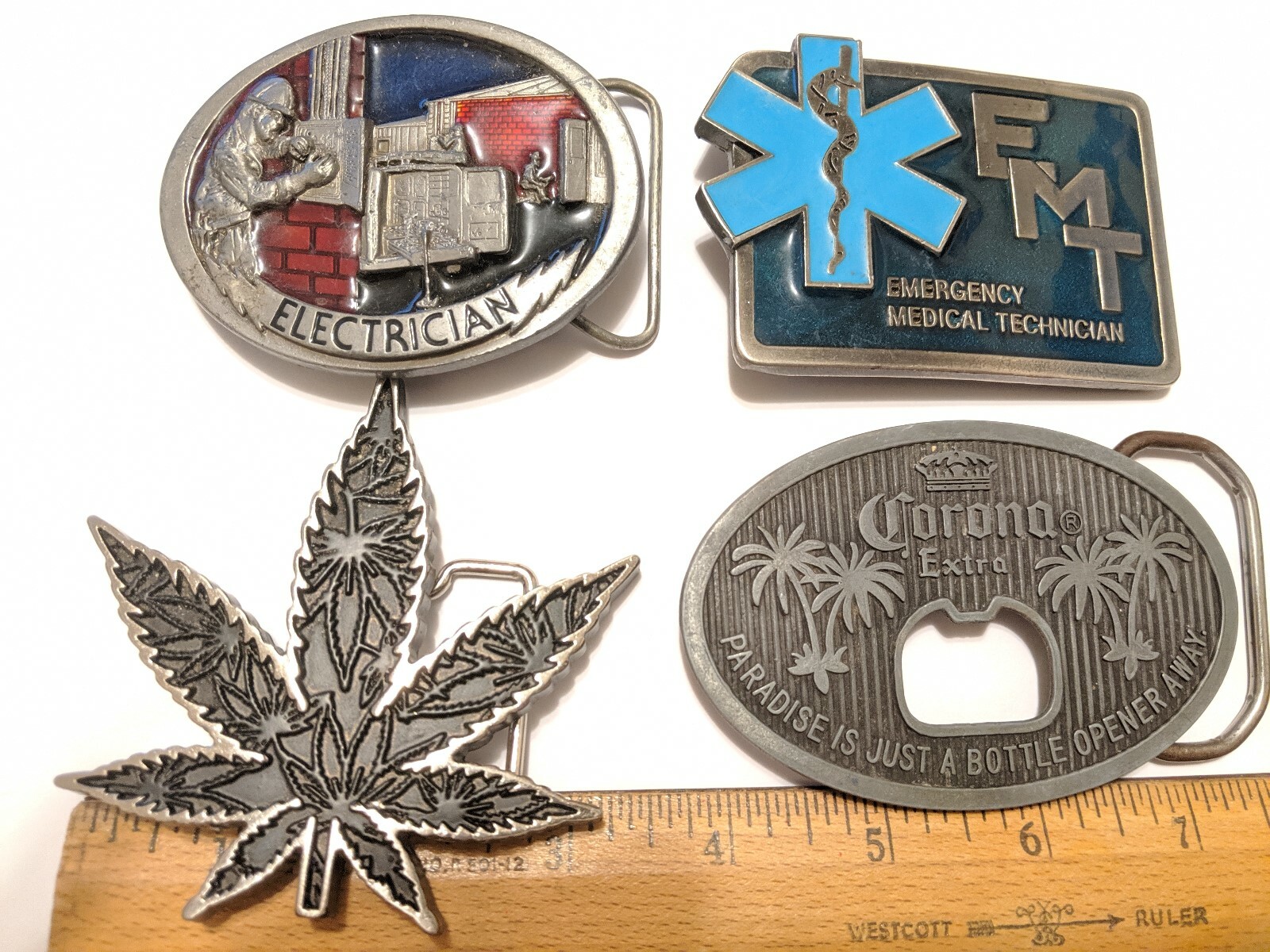 4 LOT BELT BELT BUCKLES GANJA, ELECTRICIAN, CORONA, EMT EMERGENCY TECHNICIAN