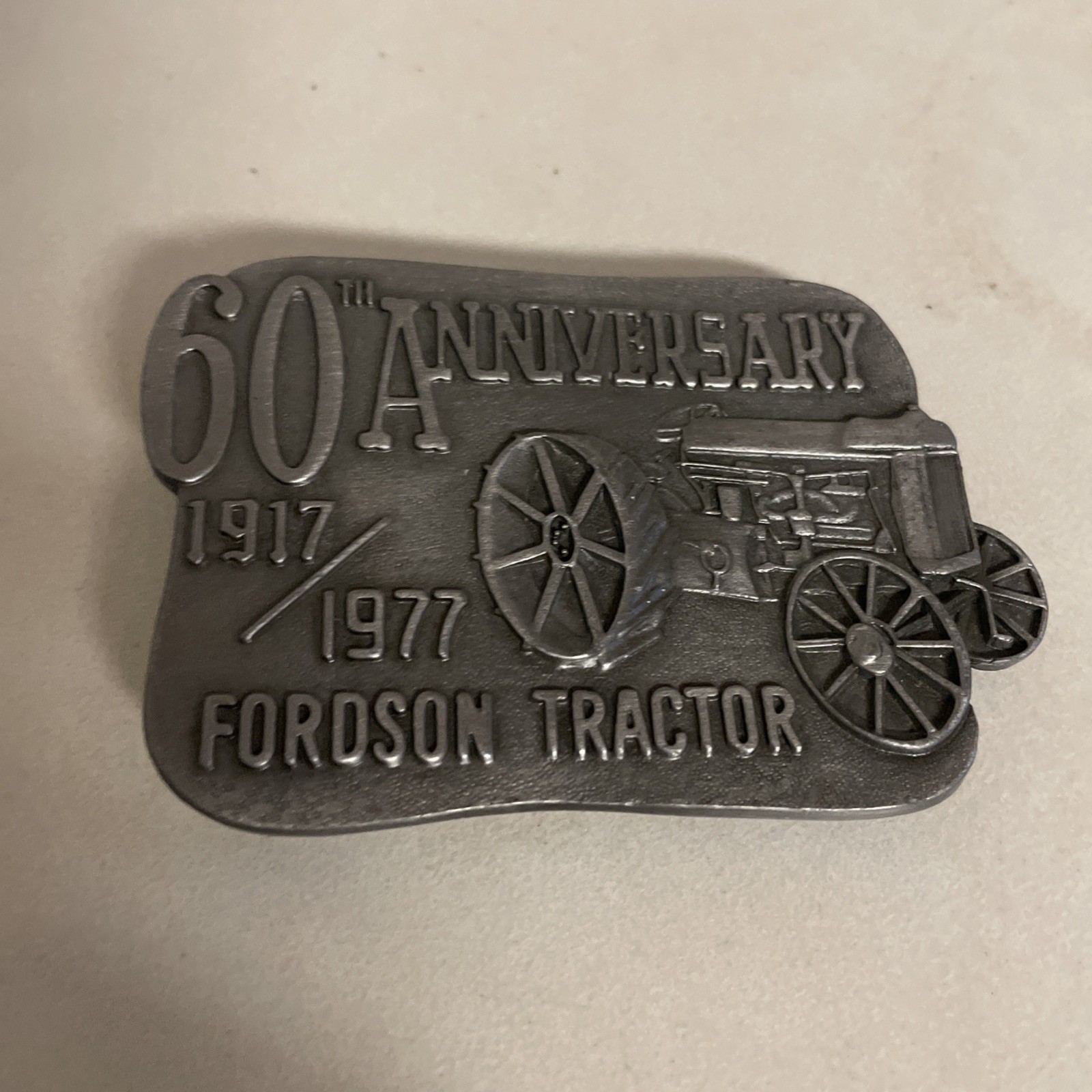 (1977) 60TH ANNIVERSARY FORDSON TRACTOR BELT BUCKLE – HEAVY METAL -2.5” x 3.25”