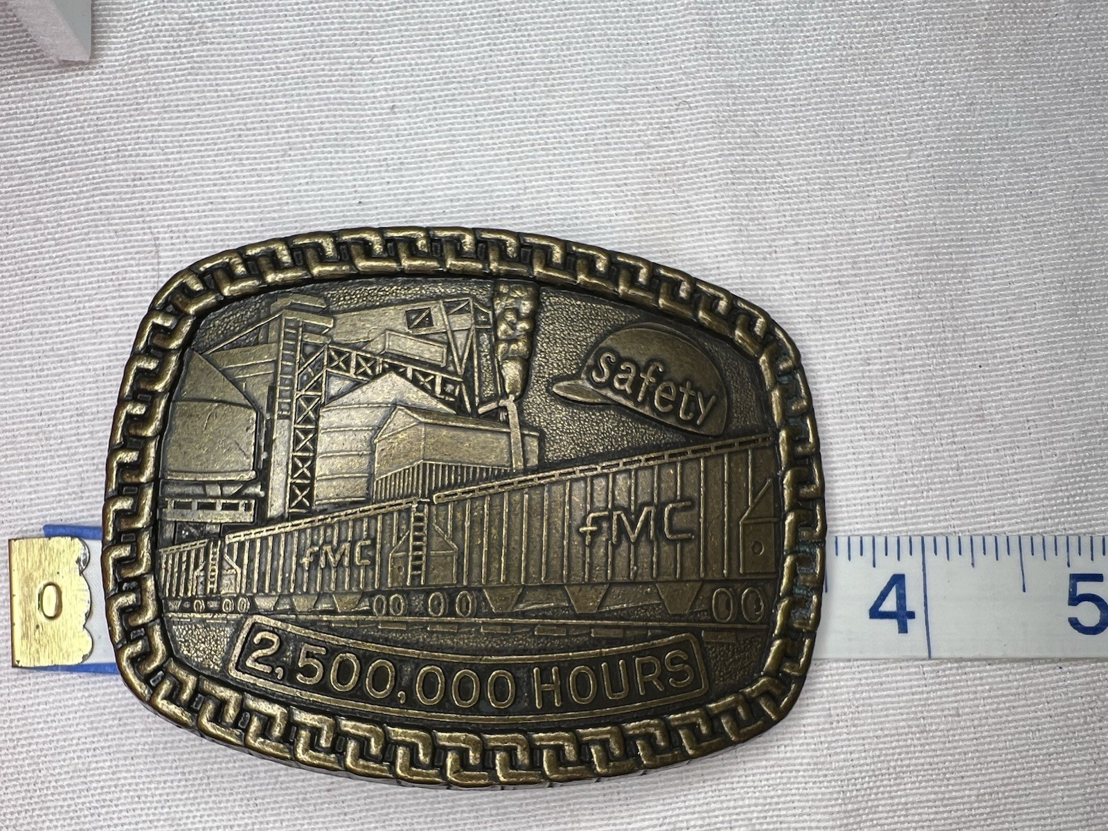 FMC Safety Award Belt Buckle – 2,500,000 Hours – Brass Industrial Factory Scene