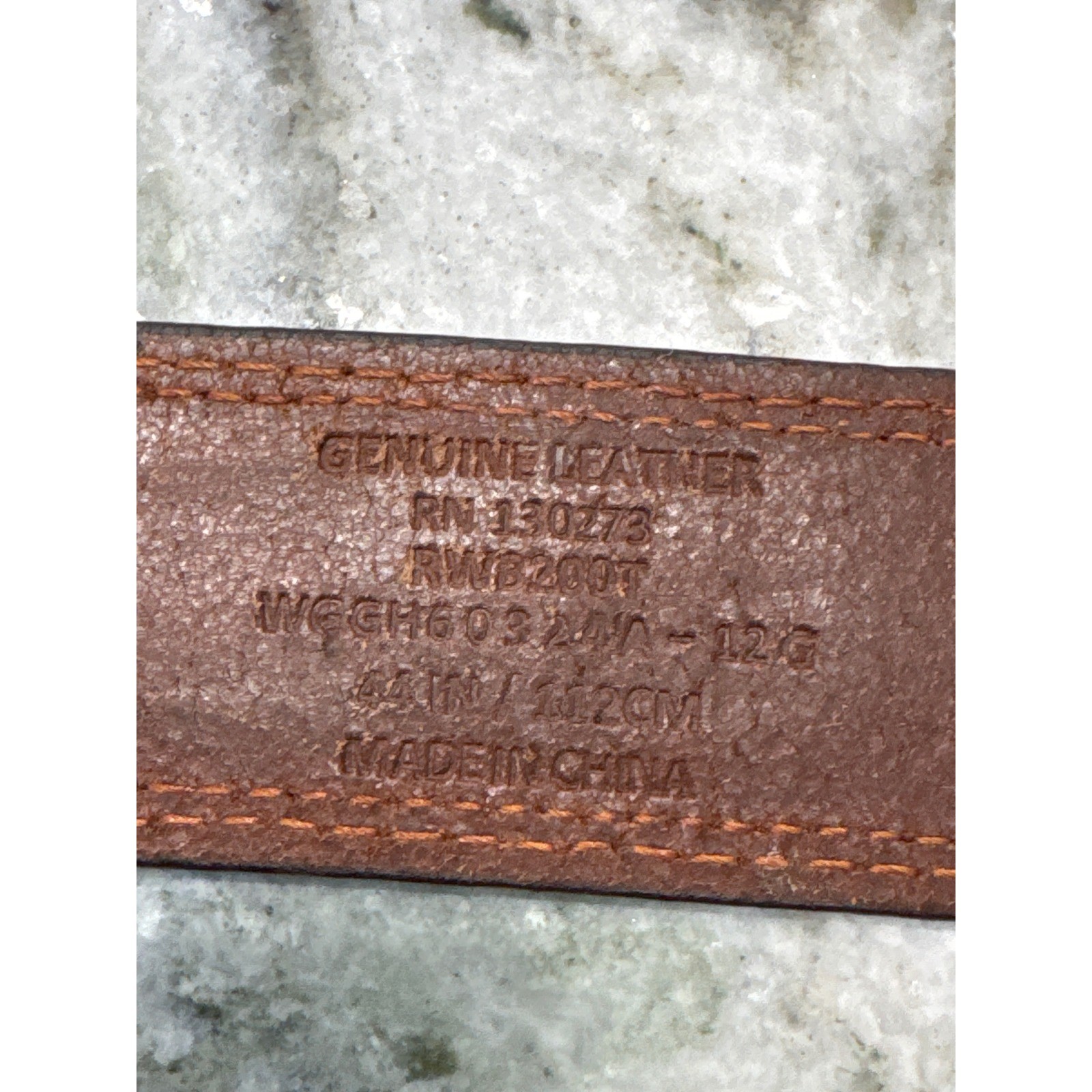 Men&rsquo;s brown leather belt featuring a prominent woven-inlay pattern size 44