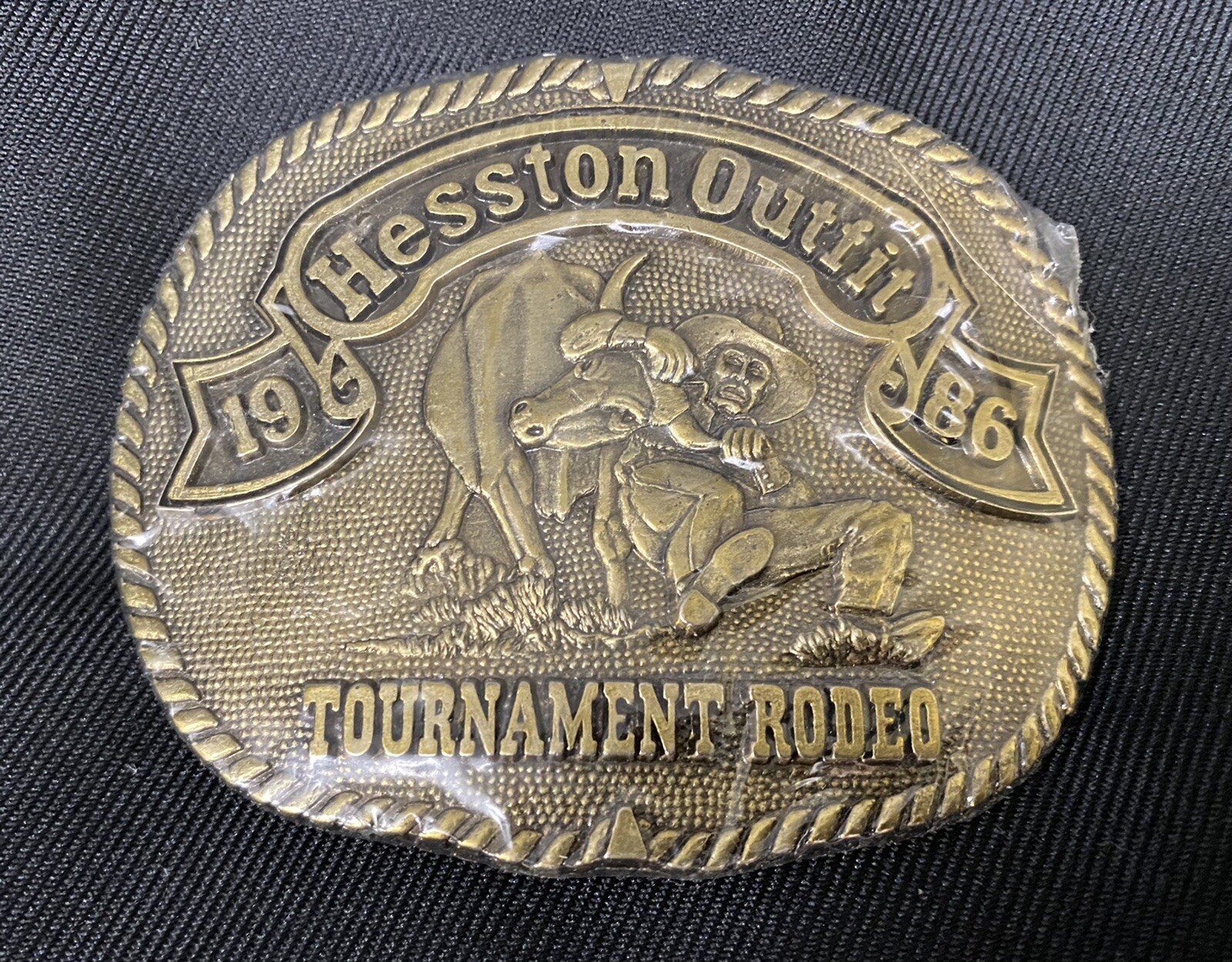 Hesston Belt Buckle 1986 3 3/4” Adult Size Brass Tournament Rodeo *New & Sealed*