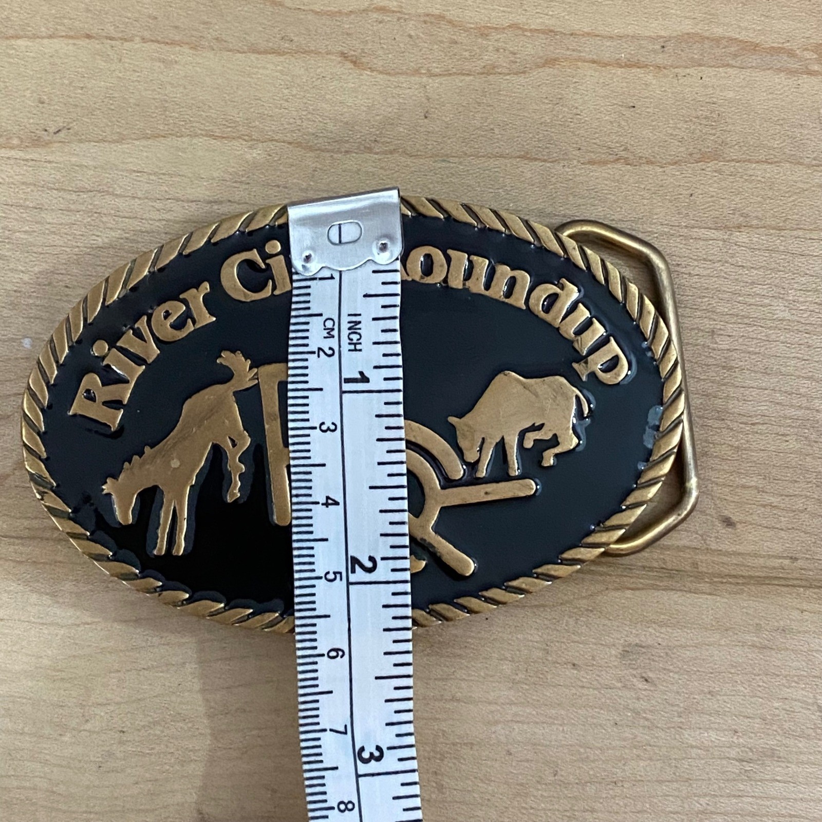 Vintage 1982 River City Roundup Belt Buckle Tapco Gold Tone Black Enamel Rodeo