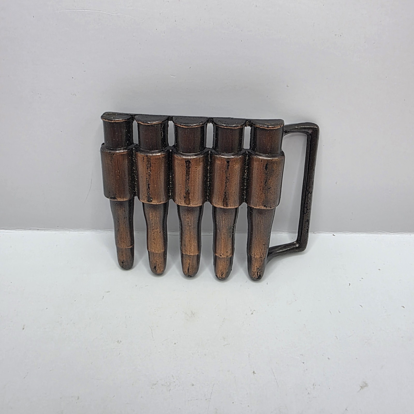 Vintage 1980&rsquo;s Metal bullet belt buckle copper tone gun ammunition. Hong Kong