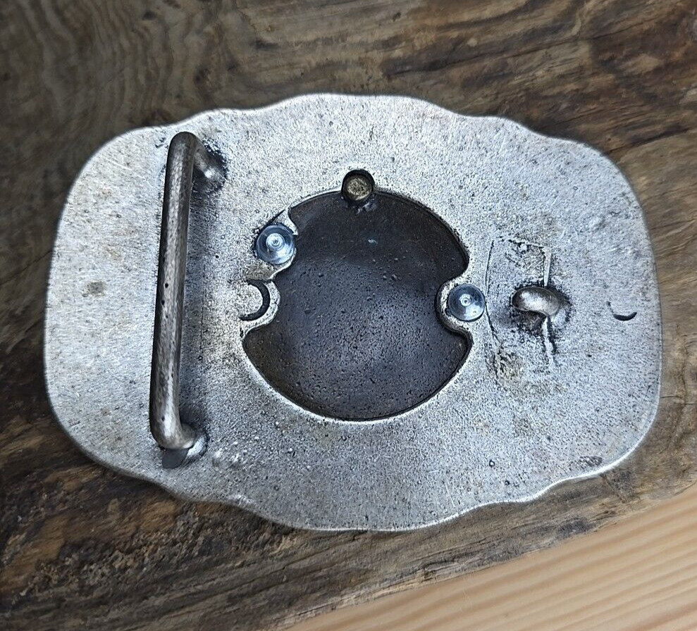 Unique vintage brass and steel belt buckle.