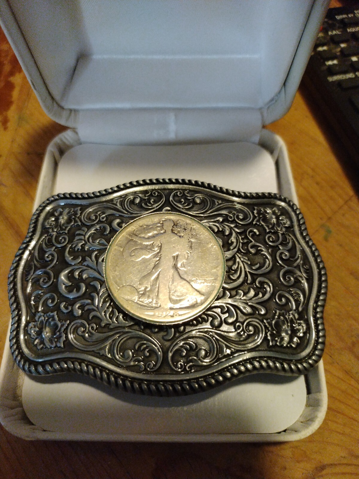 Western style belt buckle.steel with a walking liberty silver coin. 