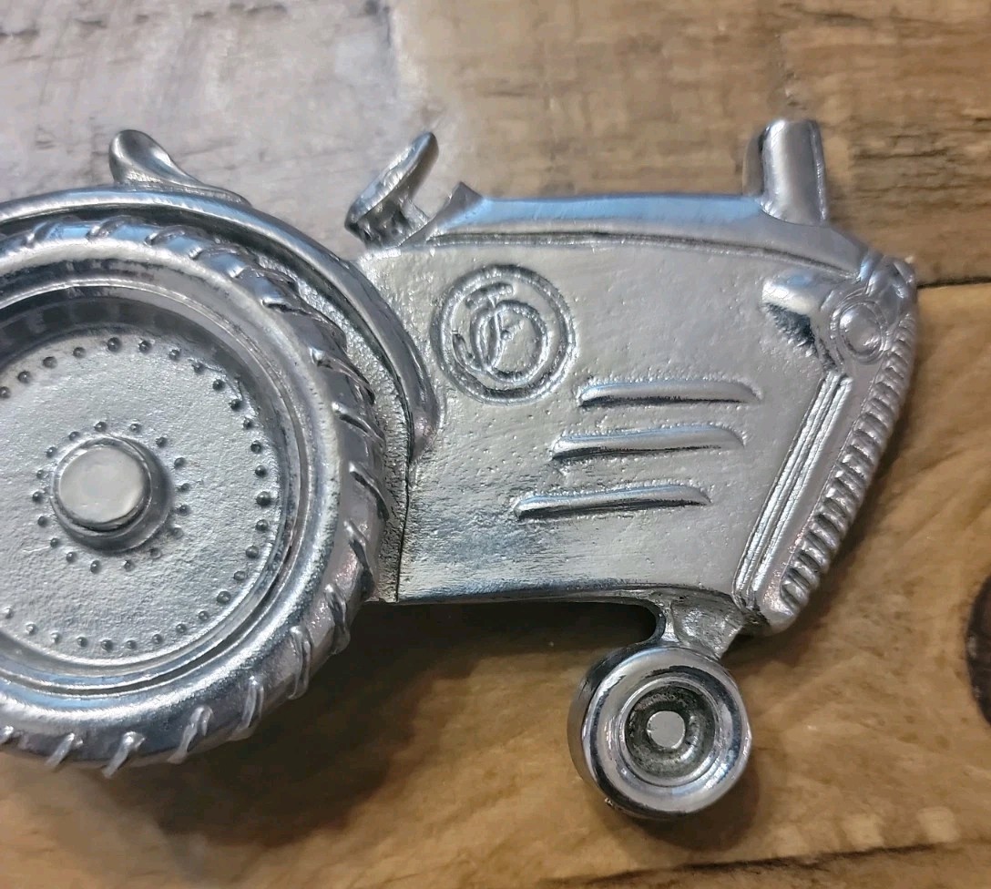 2004 Olander silver tractor belt buckle spinning back wheel