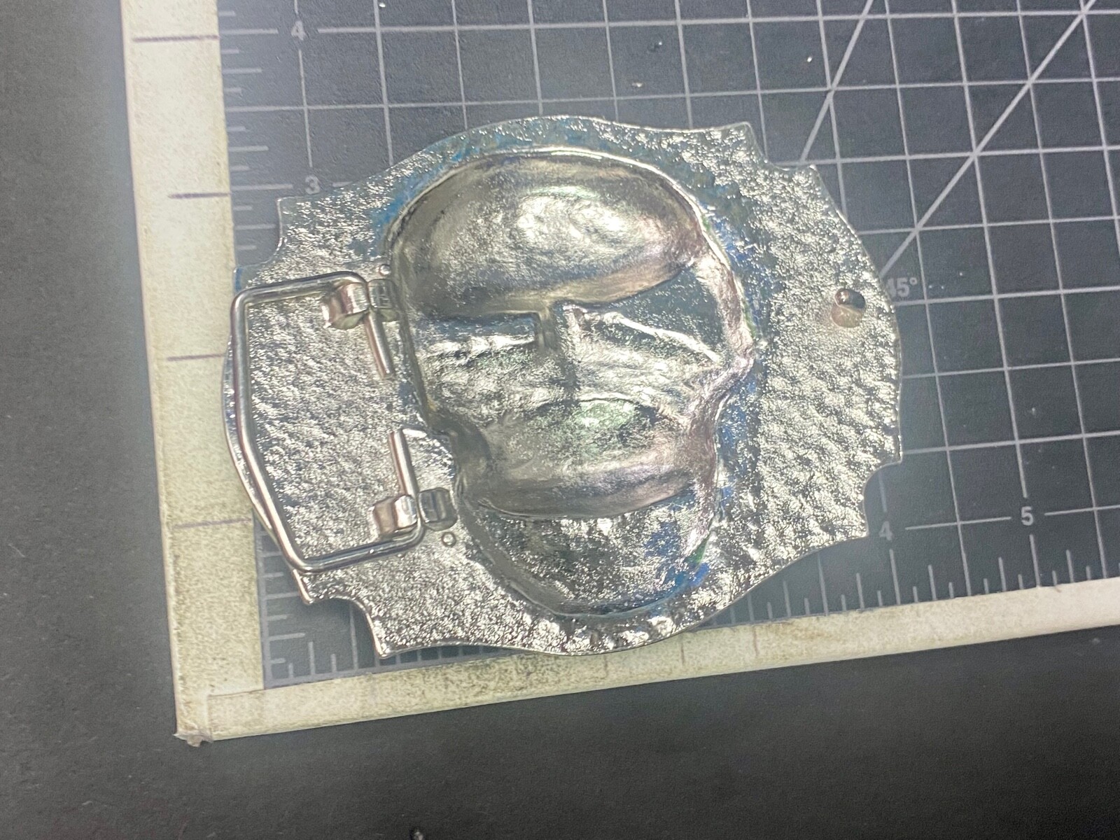 Raised Skull With Teeth Grin Black And Silver Color Belt Buckle Star Surround