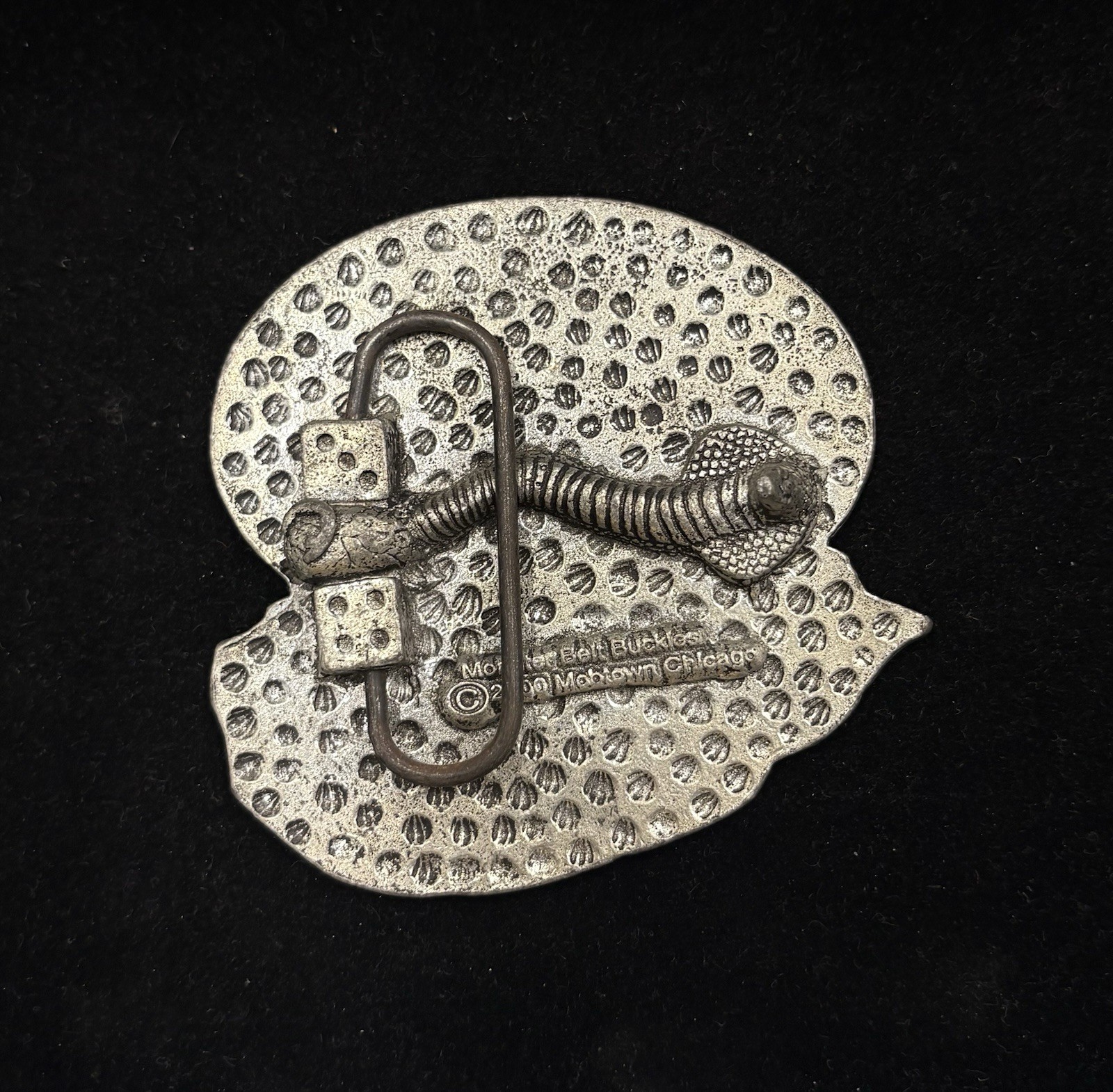 antique silver belt buckle depicts the head of Christ wearing a crown of thorns