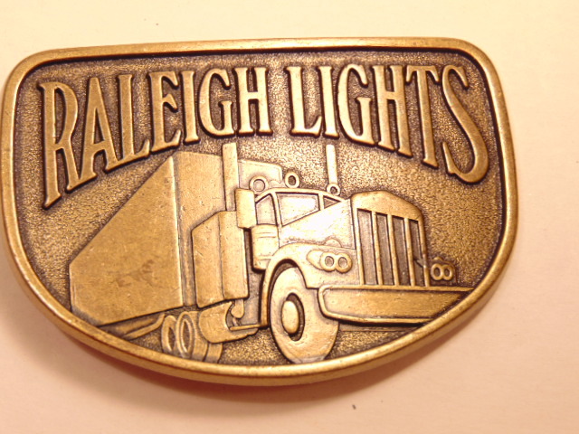 Modern brass colored advertising / trucker belt buckle: Raleigh Lights