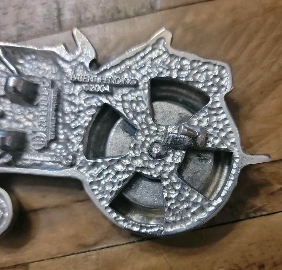 2004 Olander silver tractor belt buckle spinning back wheel