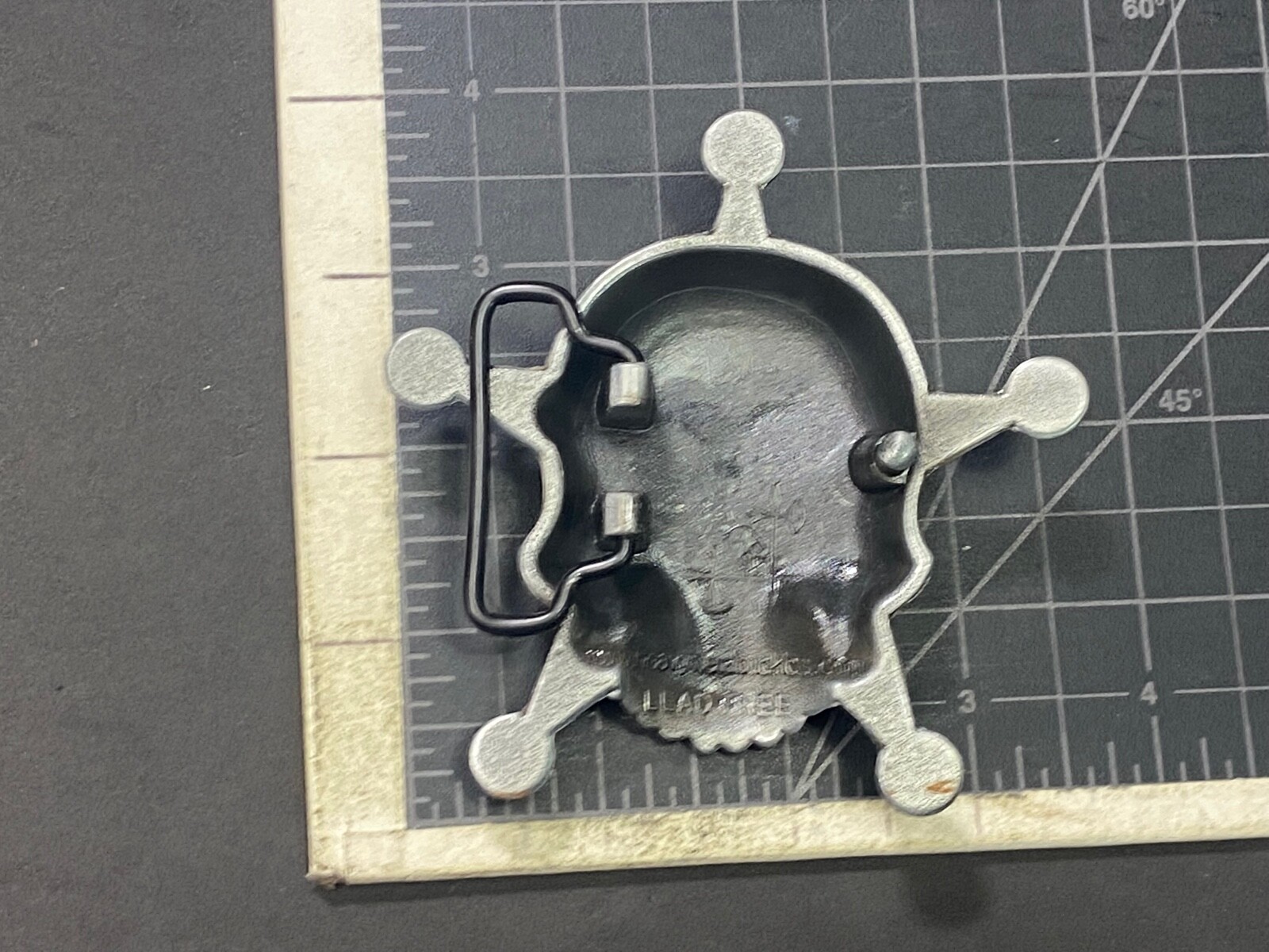 Skull with evil grin! in five point badge style star w/ Black Eyes belt buckle