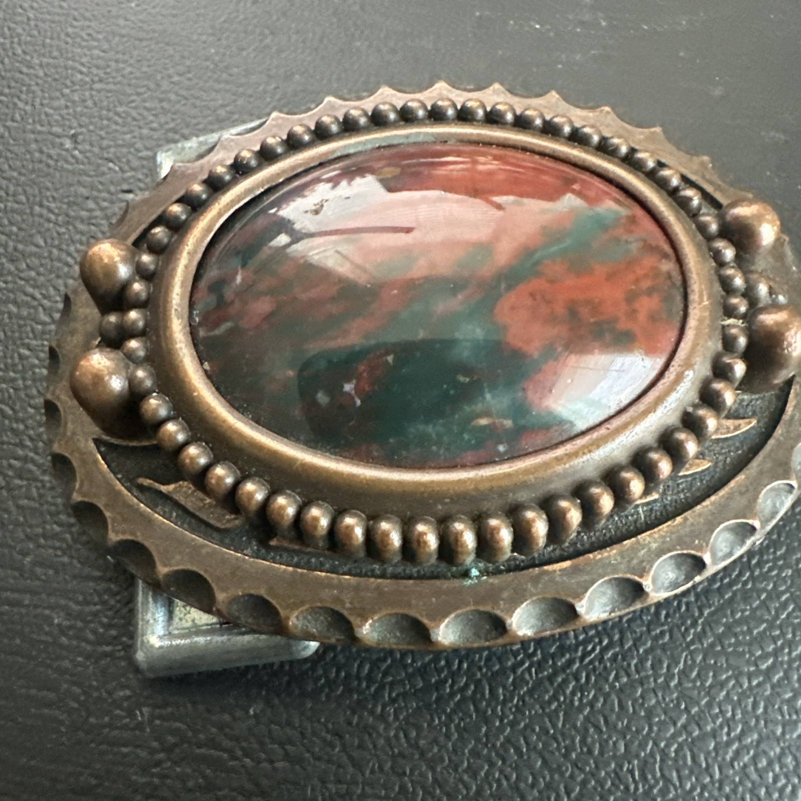 vtg ornate oval belt buckle With polished red & Green Center stone Agate?