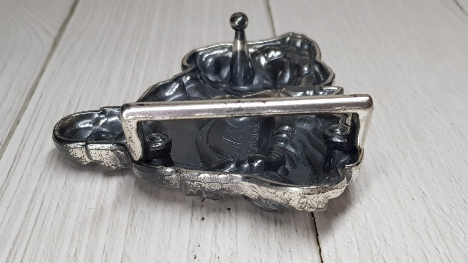Belt Buckle Buddha, Switzerland, marking