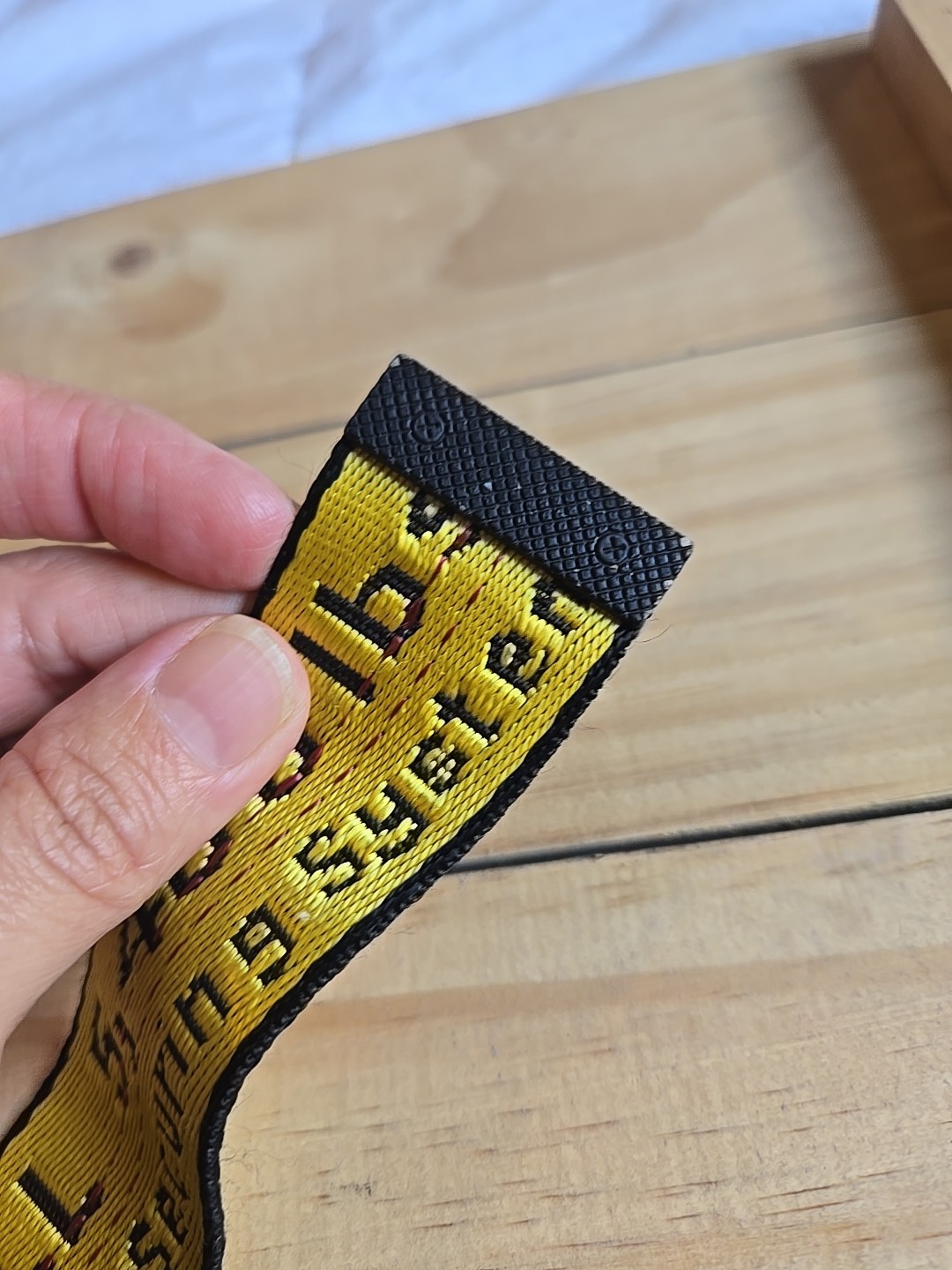 Off-White Industrial Belt in the yellow and black colorway, featuring a black…