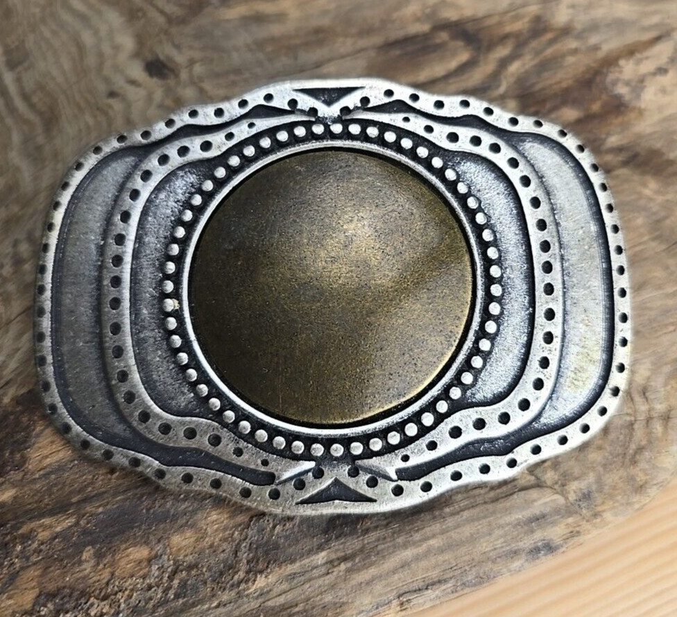 Unique vintage brass and steel belt buckle.