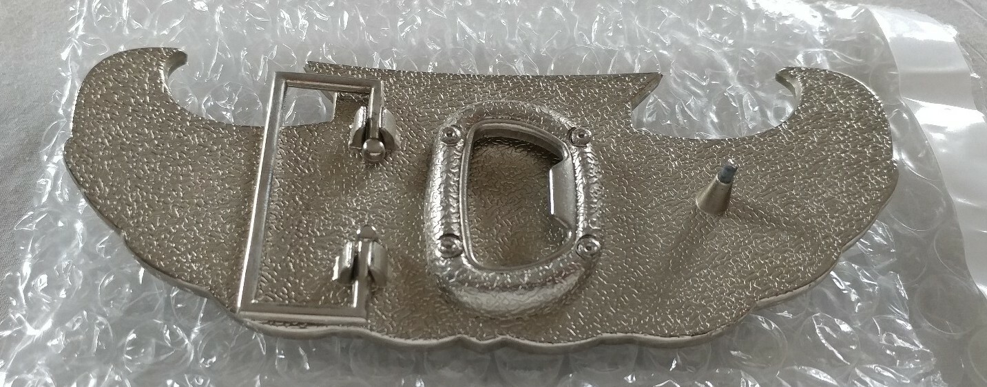 WINGS SHIELD MUD FLAP GIRL CREST BOTTLE OPENER BELT BUCKLE PRONG NEEDS REPAIR
