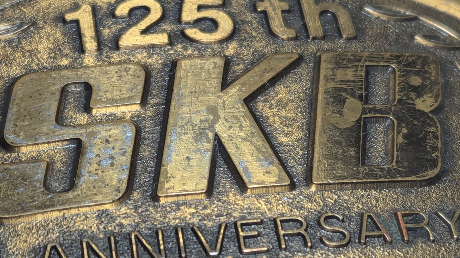 VINTAGE 125TH ANNIVERSARY SKB BELT BUCKLE