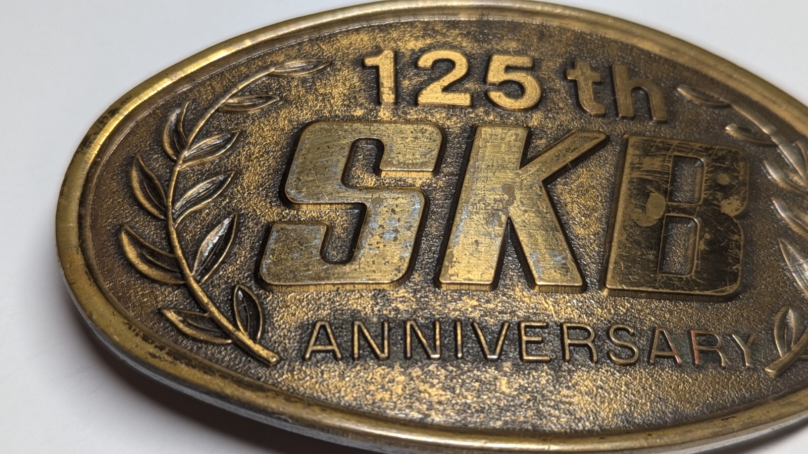 VINTAGE 125TH ANNIVERSARY SKB BELT BUCKLE