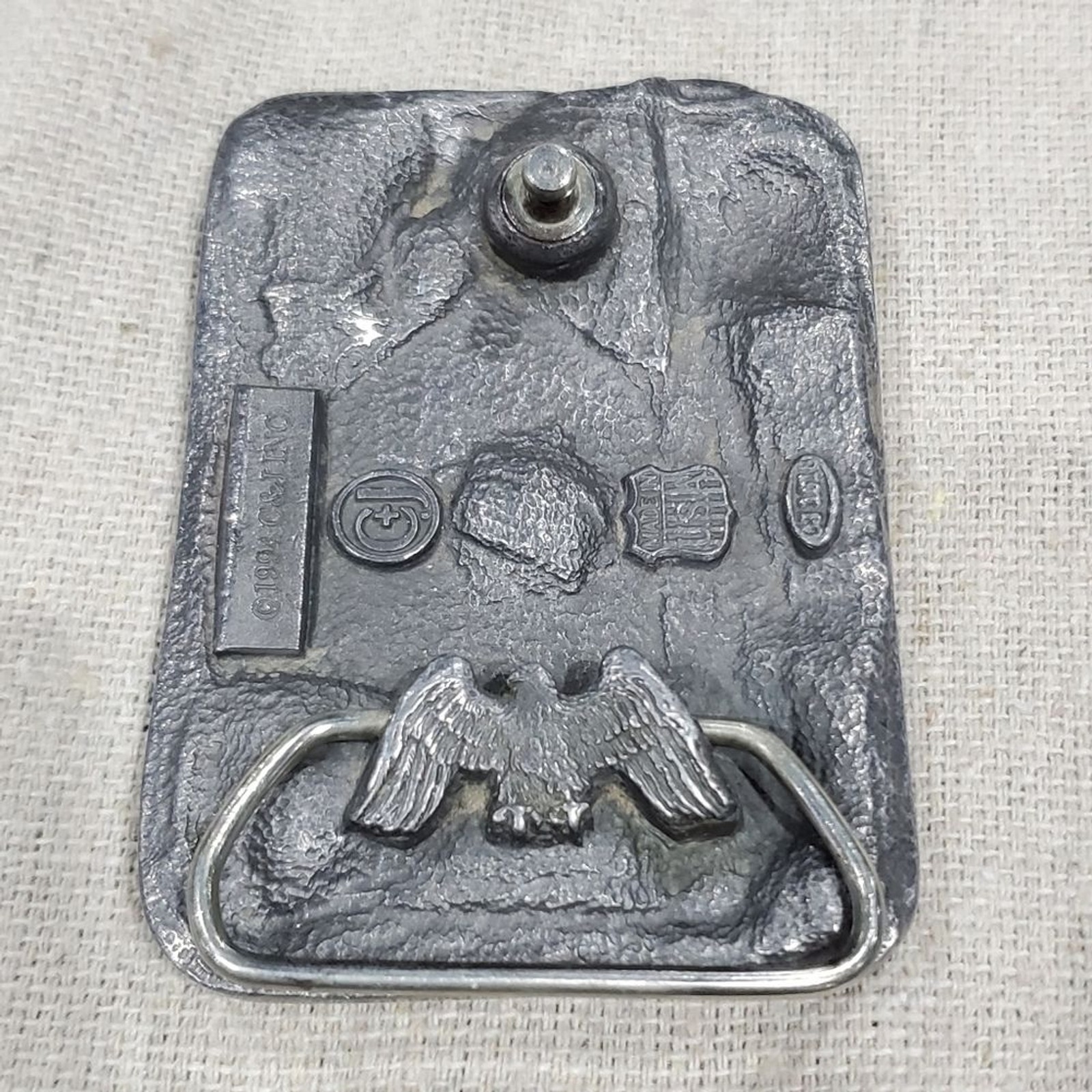 VINTAGE CARPENTER BELT BUCKLE SILVER METAL C&J INC 1994 COLLECTIBLE MENSWEAR DAD