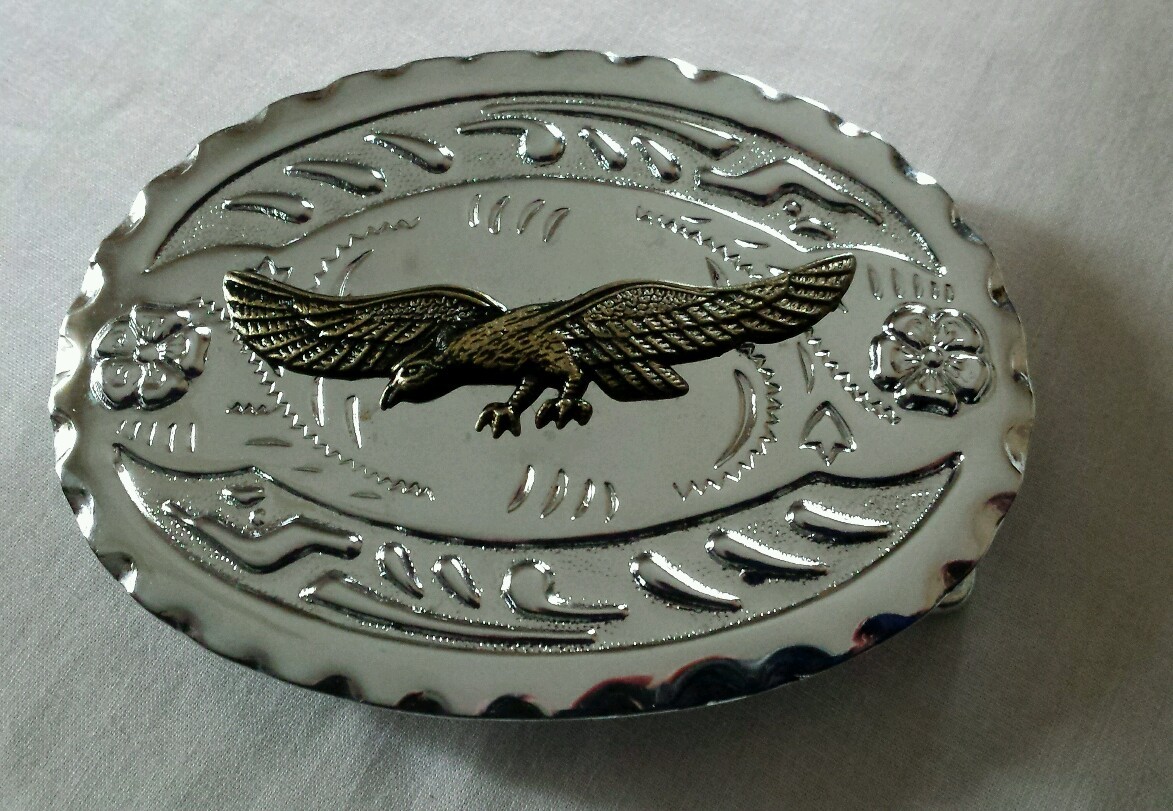 SPREAD WING BRASS TONED EAGLE WESTERN BELT BUCKLE SILVER TONED BACKGROUND