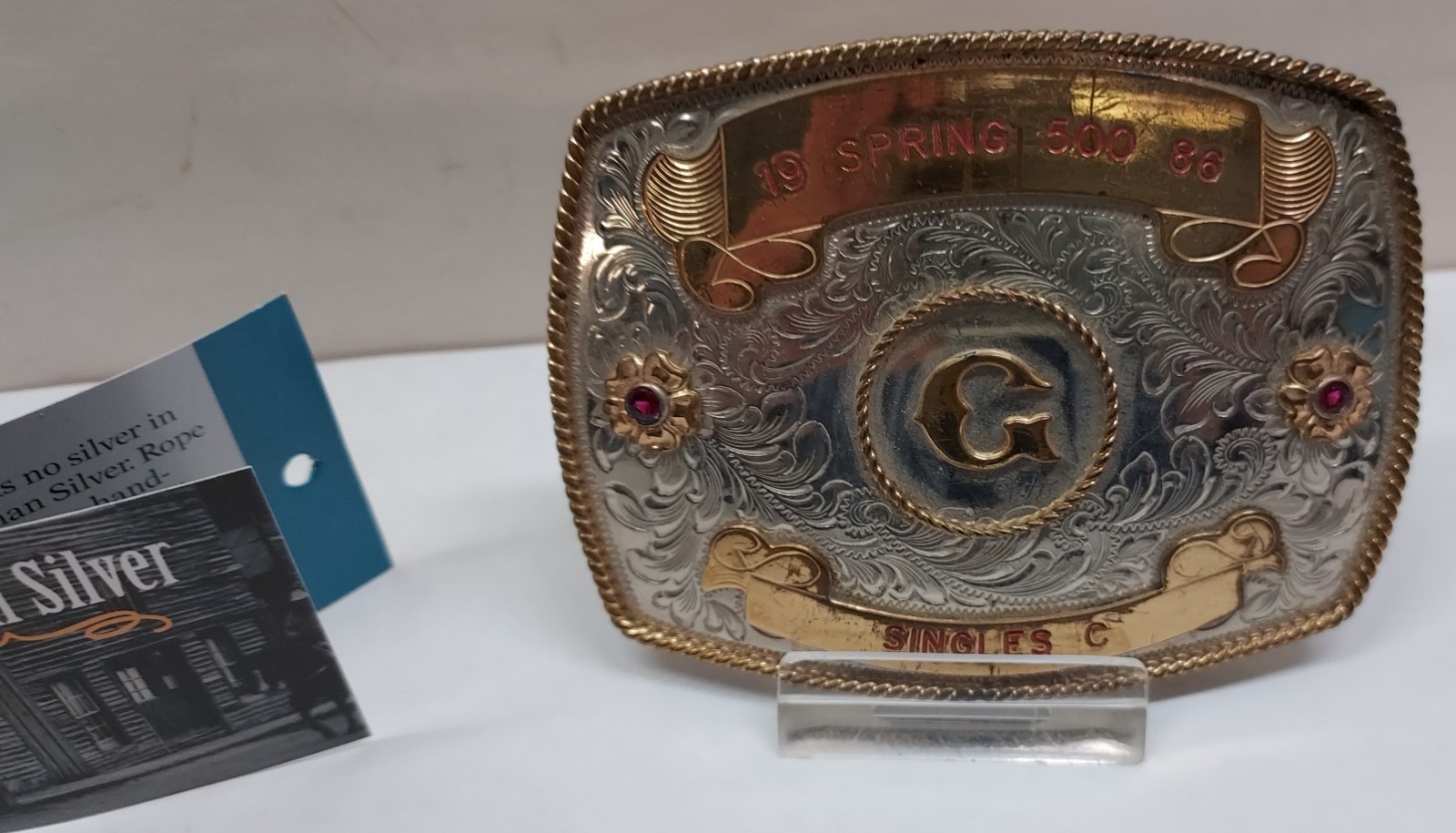 1986 – SPRING 500 – SINGLES C – GERMAN SILVER – BELT BUCKLE – listing # 9560