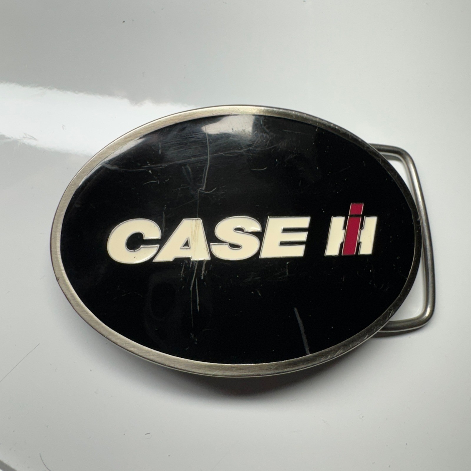 CASE IH Licensed Product Oval Belt Buckle Black Silver Tone CNH America LLC