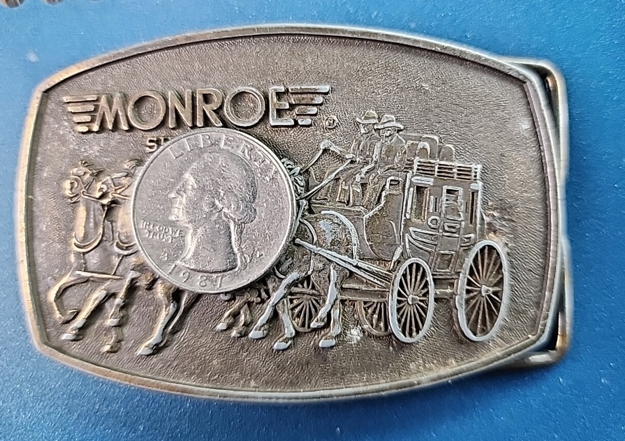 VTG 1980s MONROE SHOCKS BELT BUCKLE WILD WEST STAGECOACH SOFT RIDE