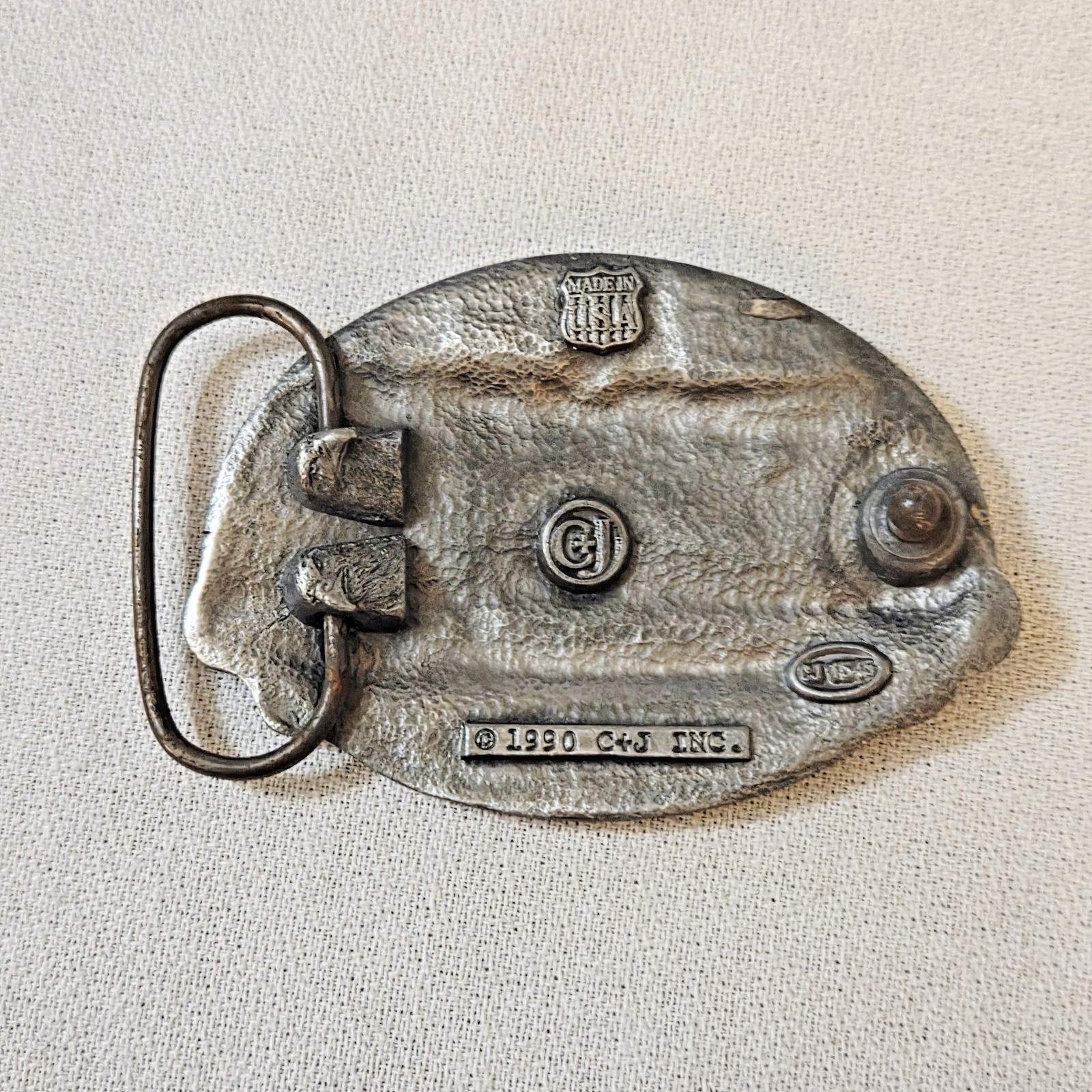 Belt Buckle – C+J Inc. 1990 Snowmobiler (with wear)