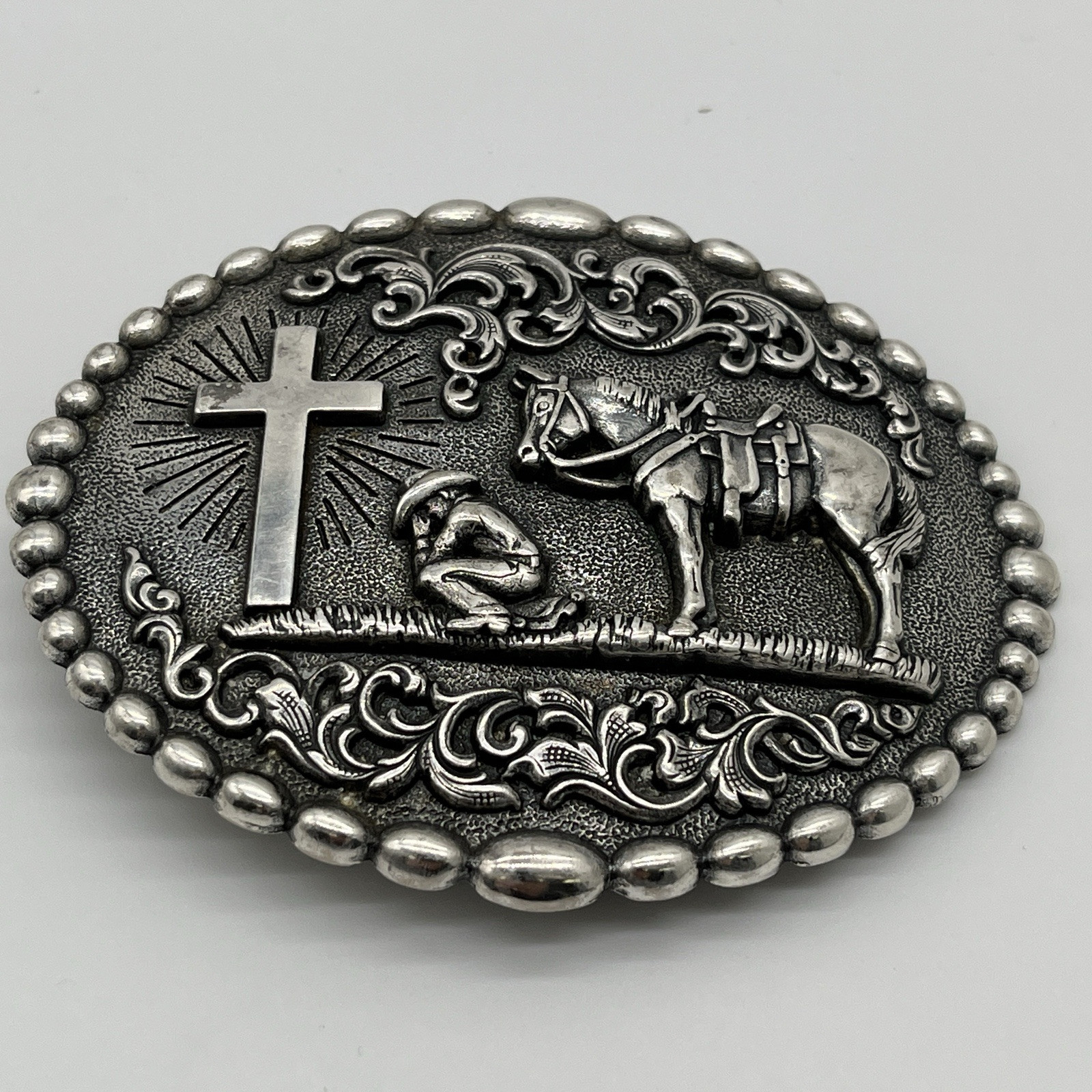 Nocona Western Belt Buckle Cowboy Man at Cross Praying Silver 37374