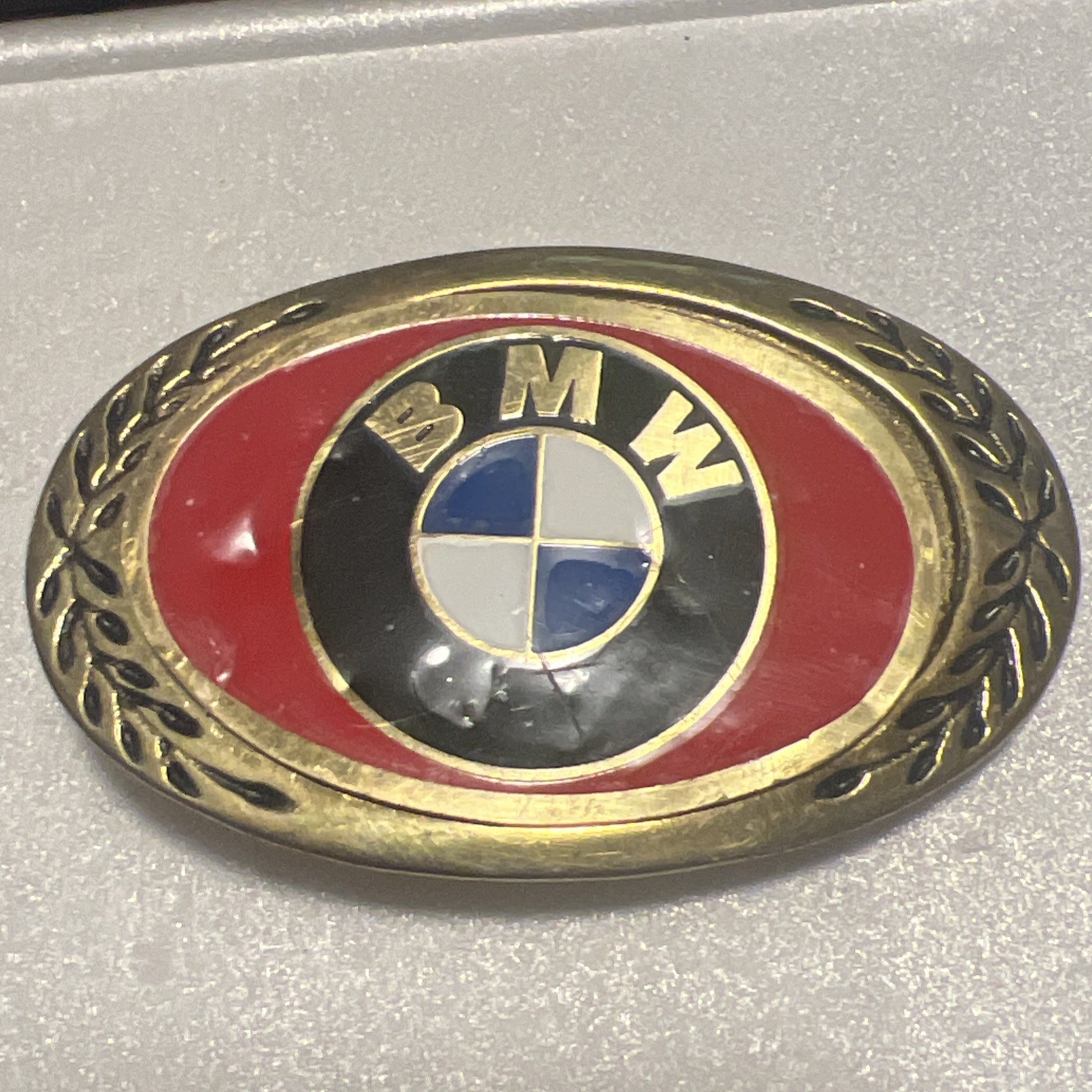 Vintage BMW Belt Buckle Brass Tone Red Enamel Logo Oval Laurel Wreath Automotive