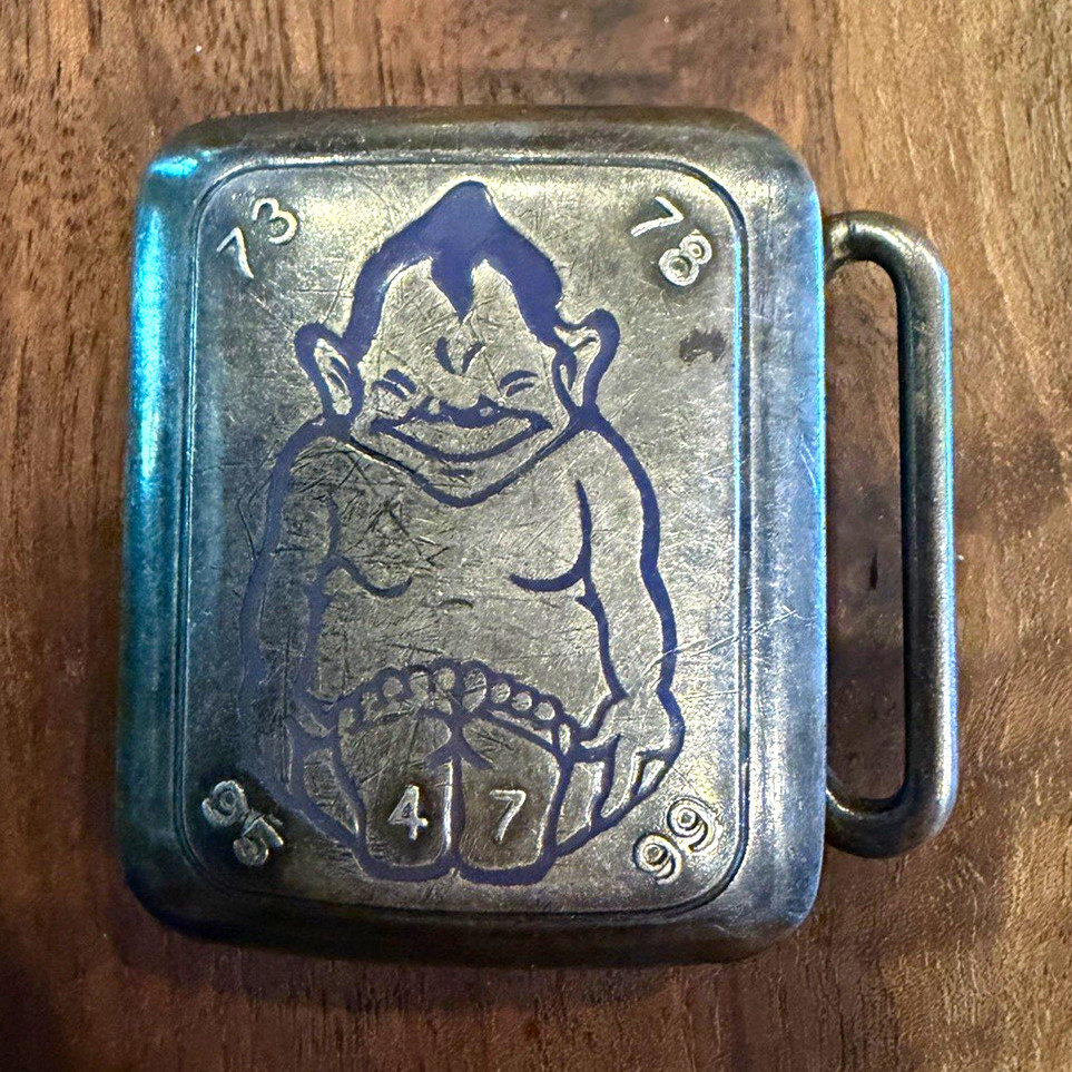This belt buckle features an engraved image of the Billiken. Hickok Plate