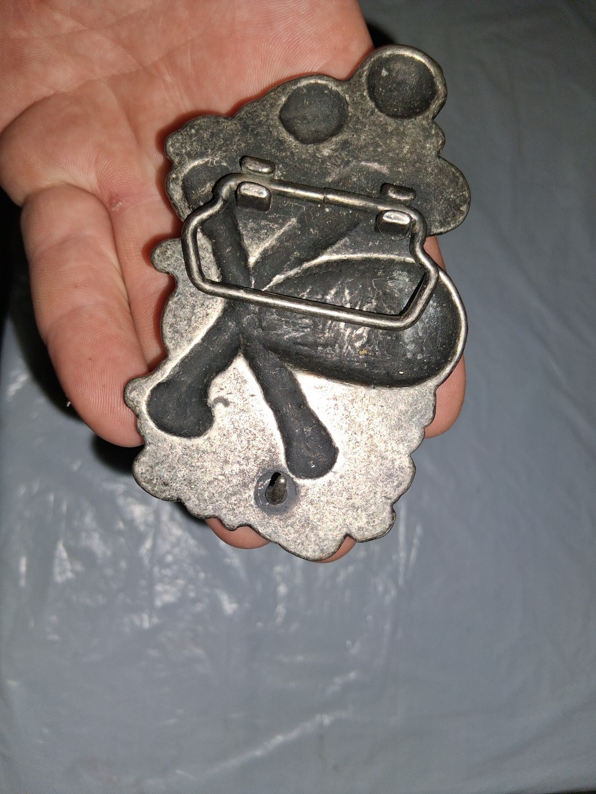 unbranded gothic belt buckle features a 3D pile of skulls and crossed bones…