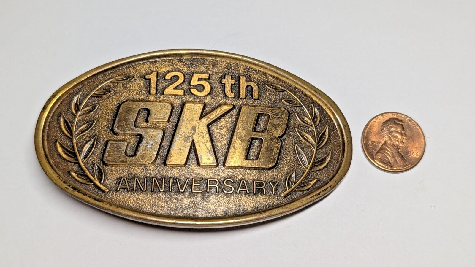 VINTAGE 125TH ANNIVERSARY SKB BELT BUCKLE