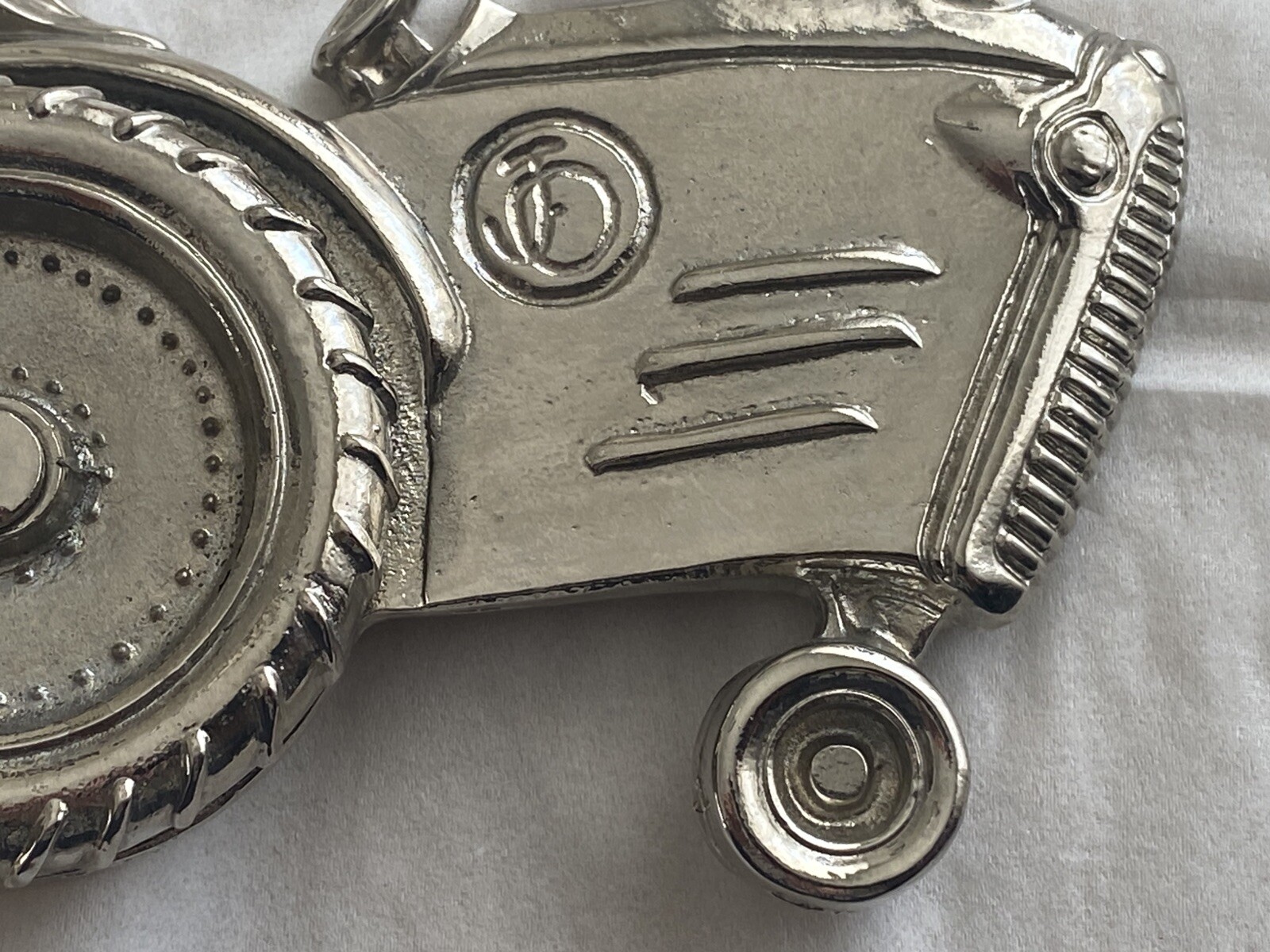 2004 Olander silver tractor belt buckle spinning back wheel