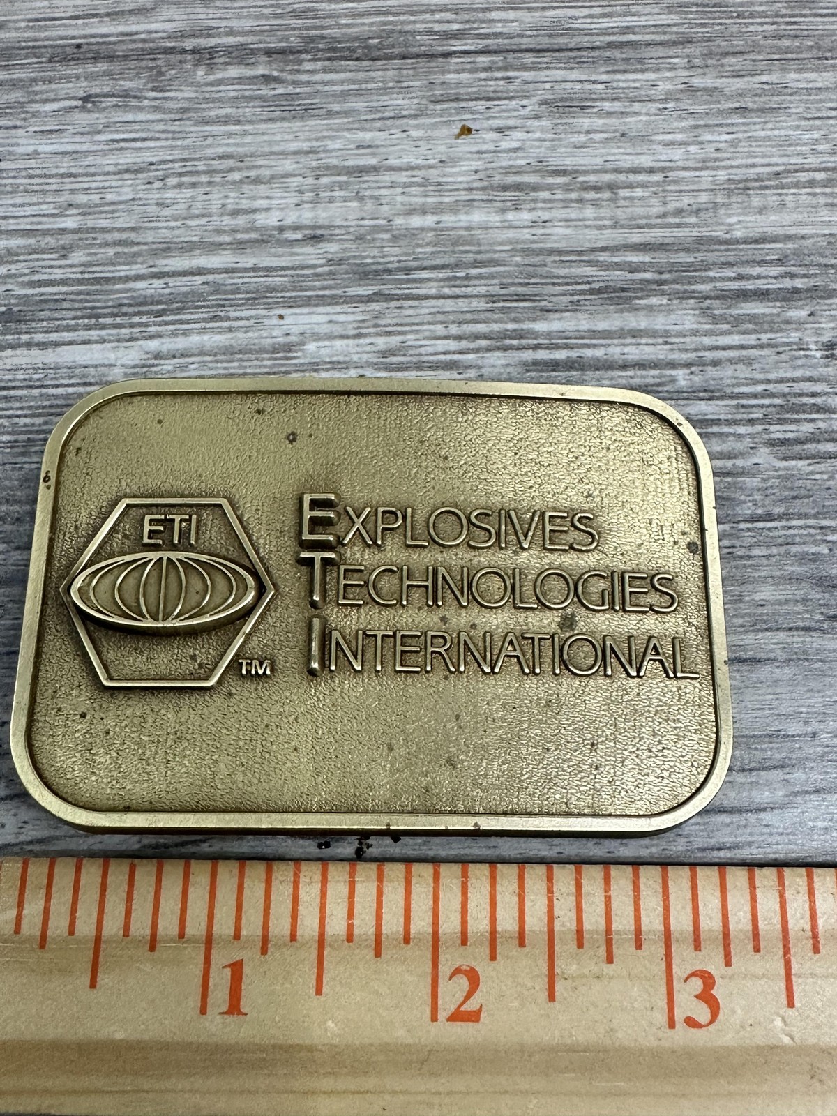 Explosives Technologies International ETI Belt Buckle Mens Brass Tone CD Hit