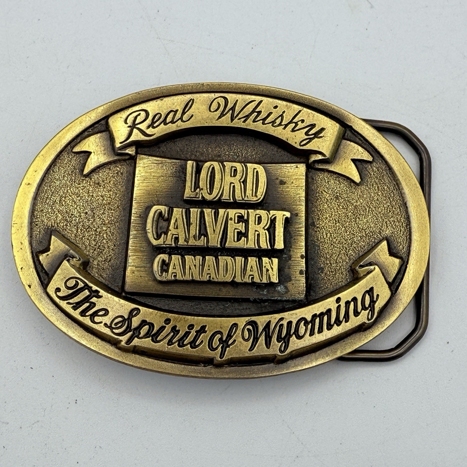 Vtg CLC Lord Calvert Canadian Sprit Of Wyoming Belt Buckle Whisky
