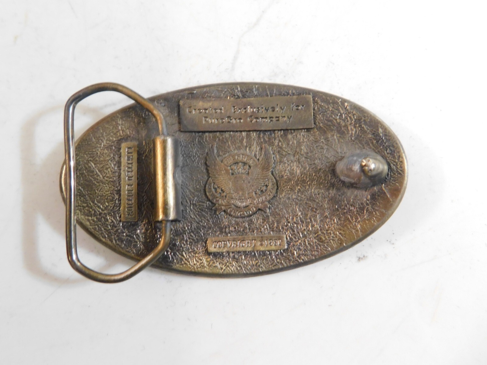 1980 PURE GRO BELT BUCKLE BY THE GREAT AMERICAN BUCKLE CO. BRASS