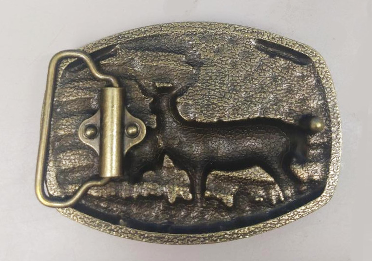 Beautiful high relief buckle showing a deer with mate against US flag.