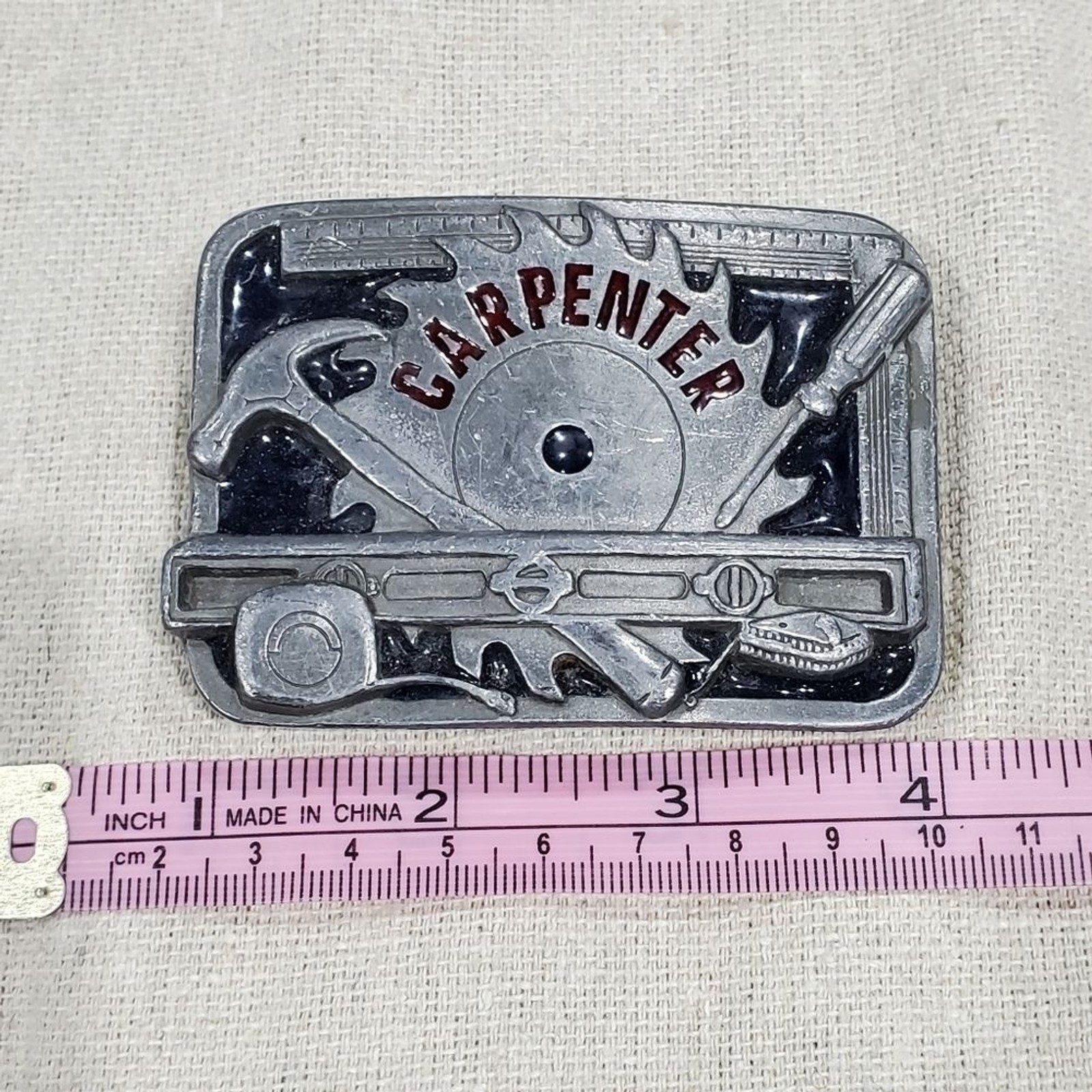 VINTAGE CARPENTER BELT BUCKLE SILVER METAL C&J INC 1994 COLLECTIBLE MENSWEAR DAD