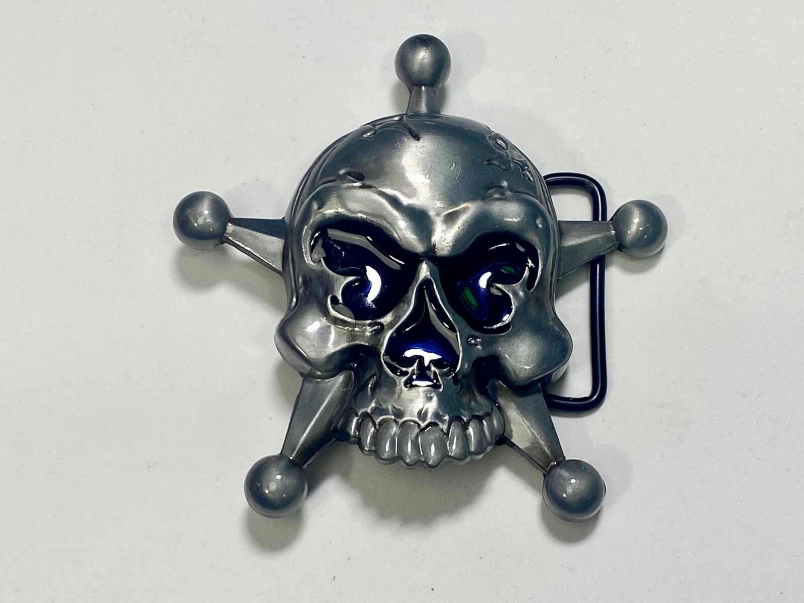 Skull with evil grin! in five point badge style star w/ Black Eyes belt buckle