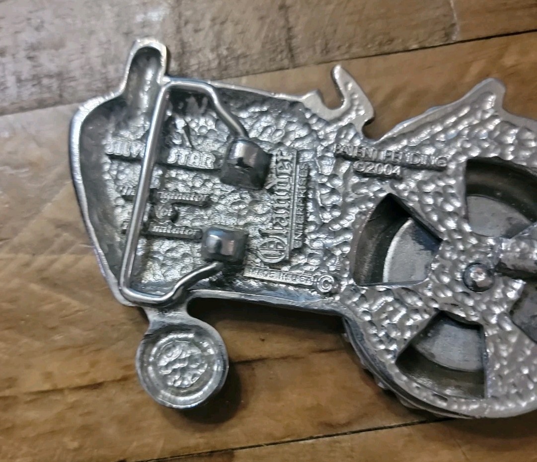 2004 Olander silver tractor belt buckle spinning back wheel