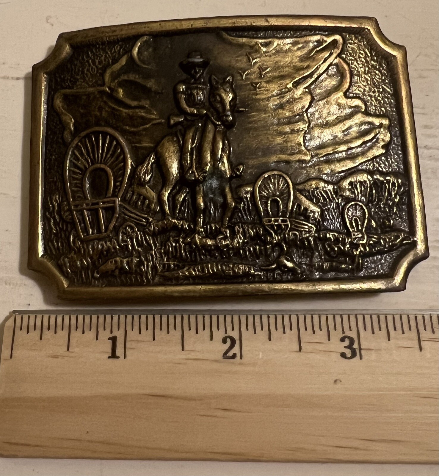 Belt Buckle With A Man And A Horse On It