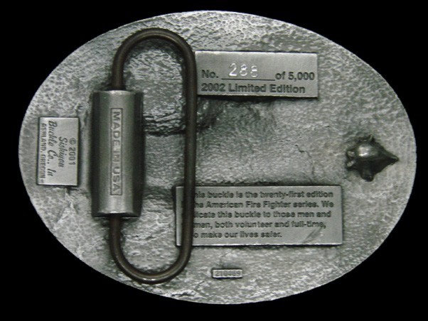 TA17159 2002 **AMERICAN FIREFIGHTER LAYING IT ON THE LINE** COMMEMORATIVE BUCKLE
