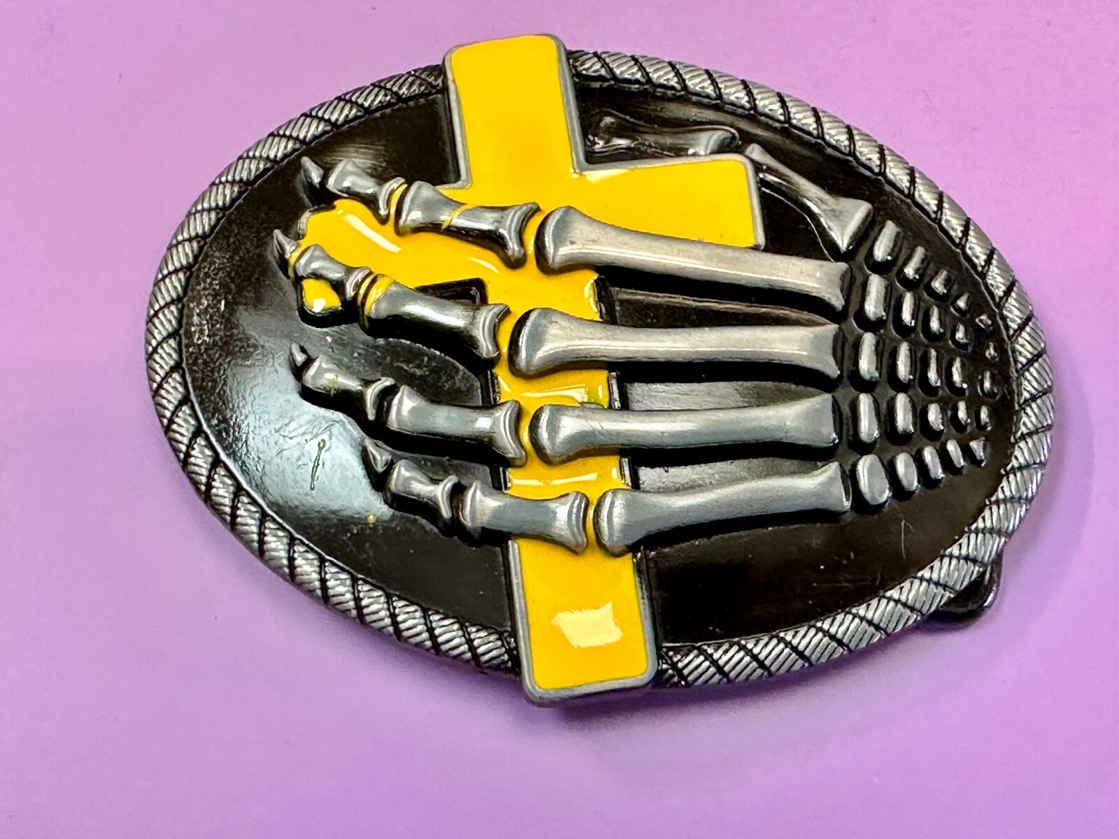 Skeleton Hand Holding Yellow Cross Vintage Dimensional Raised Belt Buckle