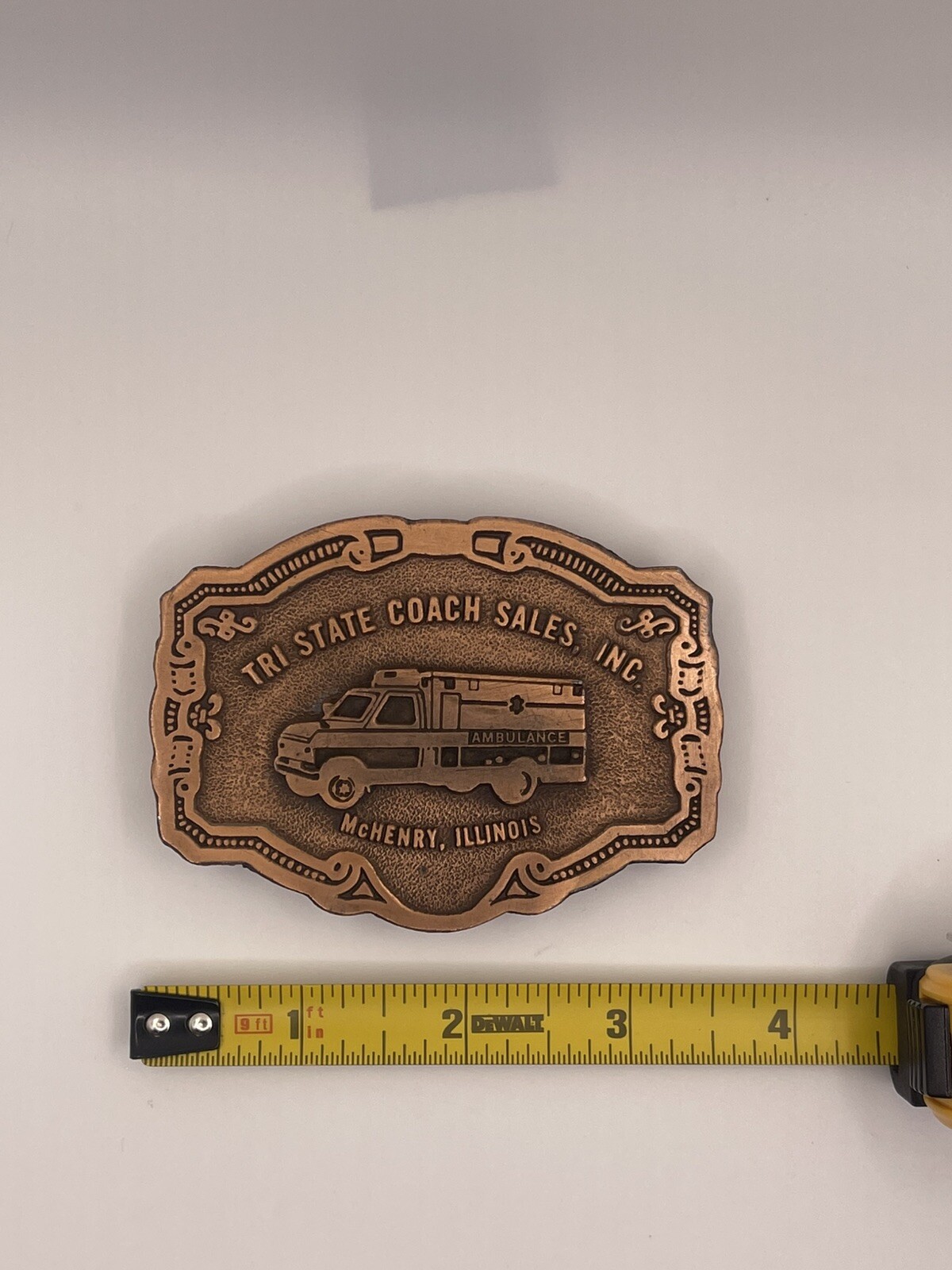 AMBULANCE BELT BUCKLE / TRI-STATE COACH SALES, INC. Mc HENRY, ILLINOIS
