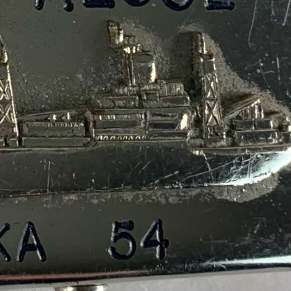 U.S. Navy belt buckle. “U.S.S. Algol AKA-54. Raised ship graphic.